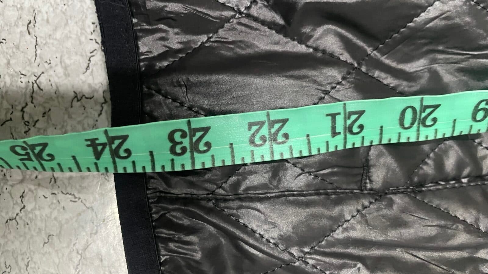 Branded thrift puffer jacket India close-up