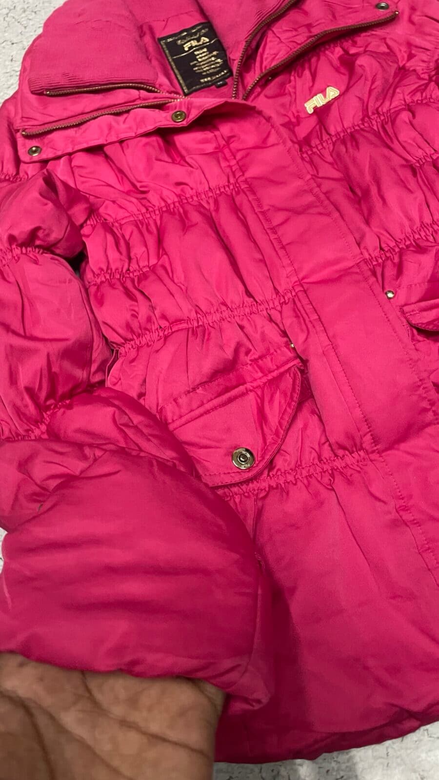 Fila thrift puffer jacket India close-up