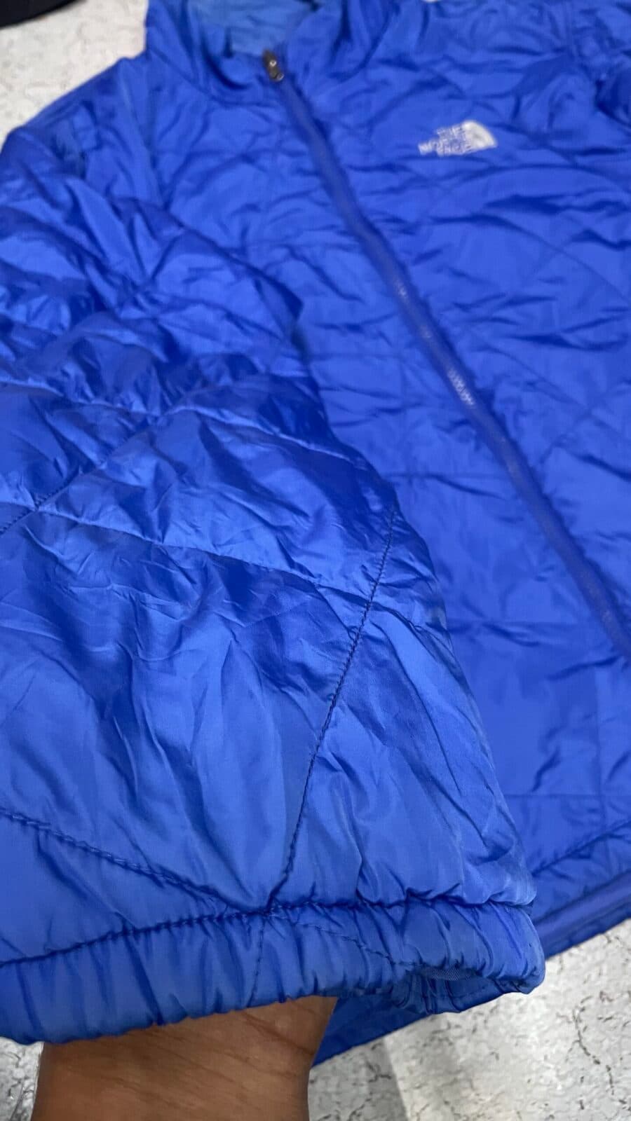 The North Face thrift puffer jacket India close-up