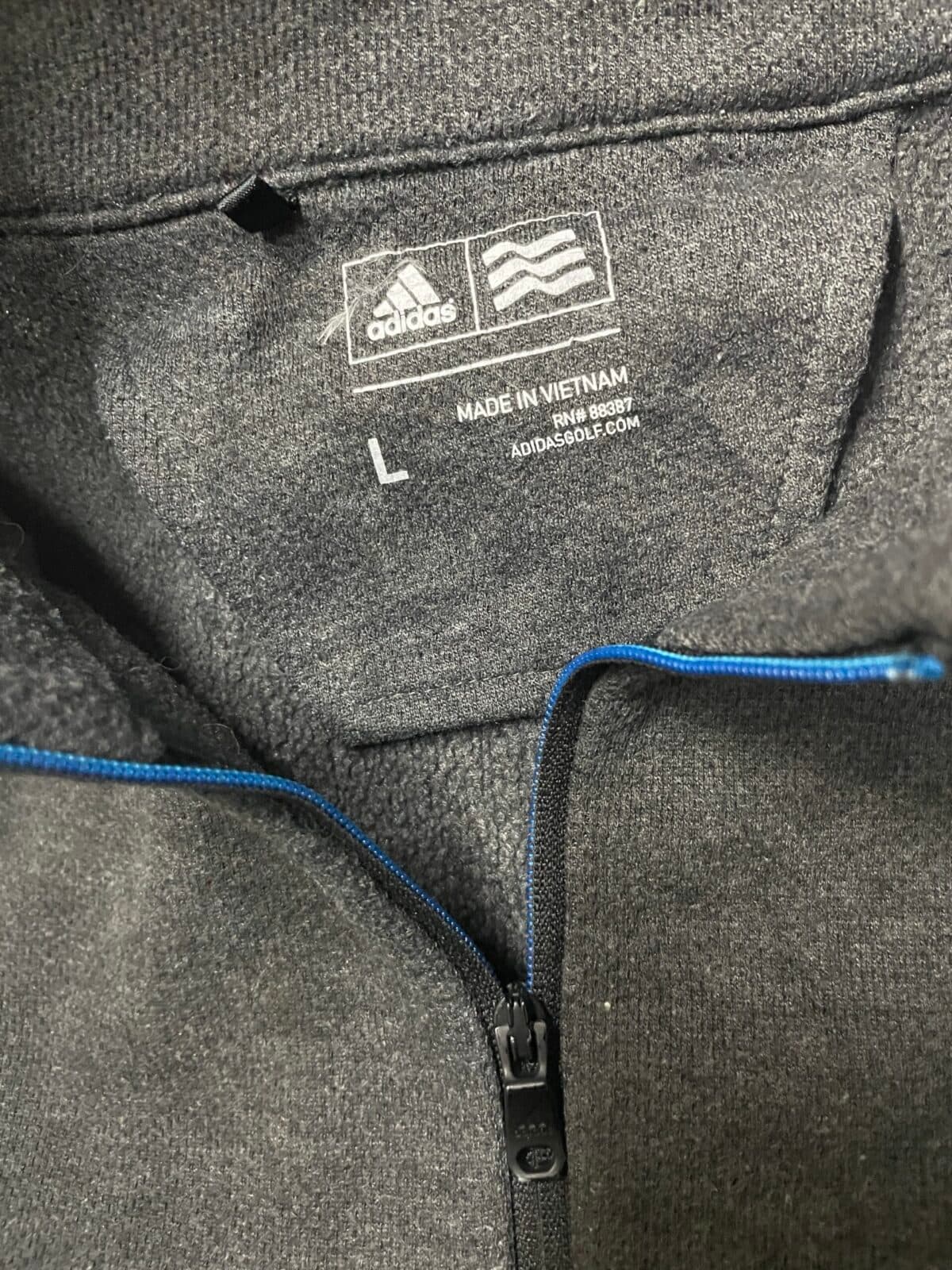 Adidas thrift sweater India close-up