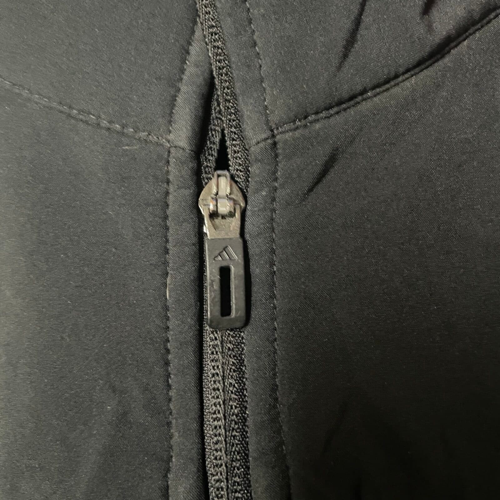 Adidas thrift puffer jacket India close-up