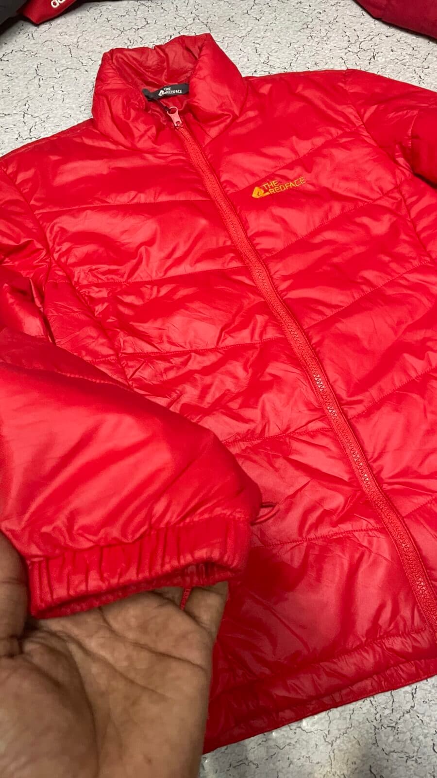 Branded thrift puffer jacket India close-up