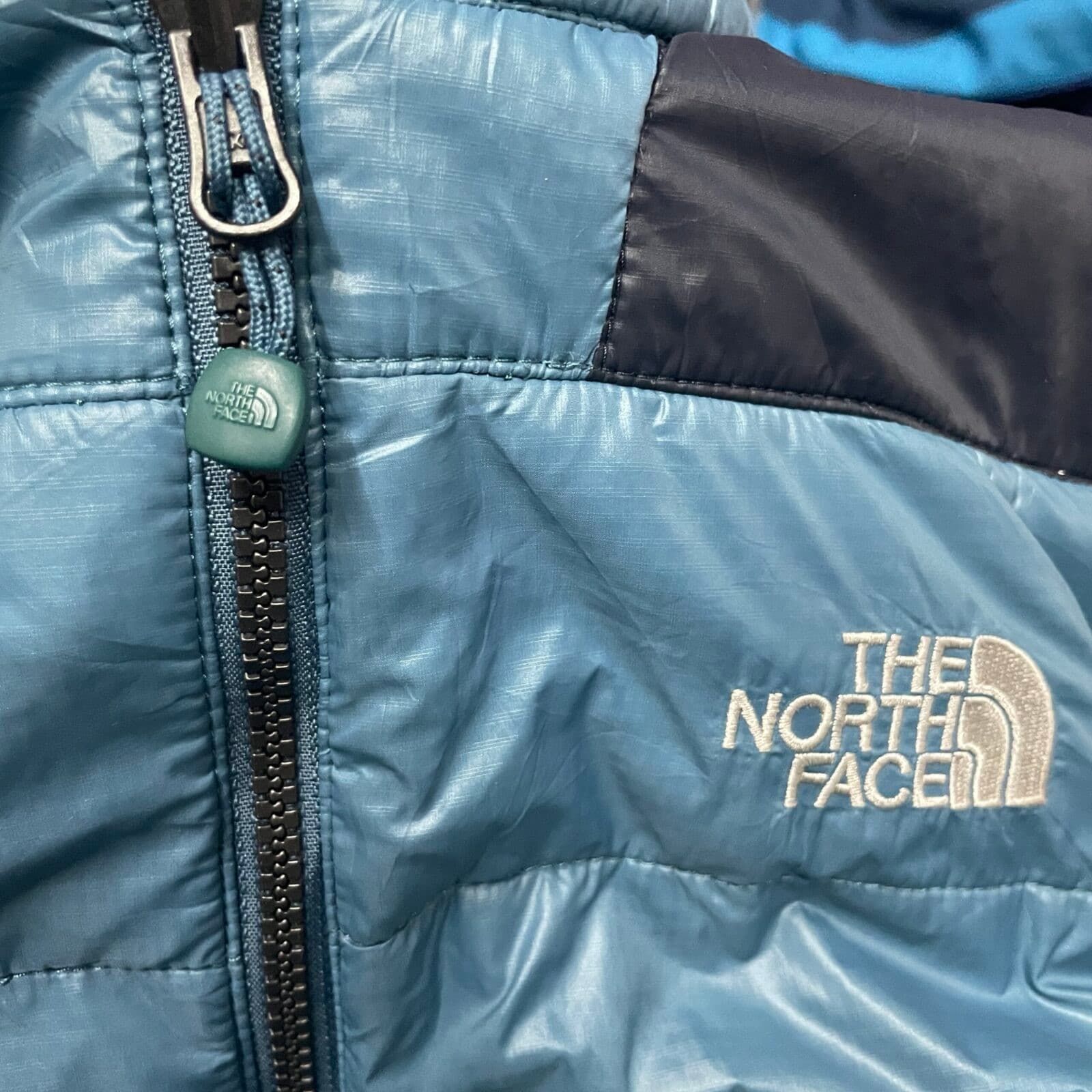 The North Face thrift puffer jacket India close-up