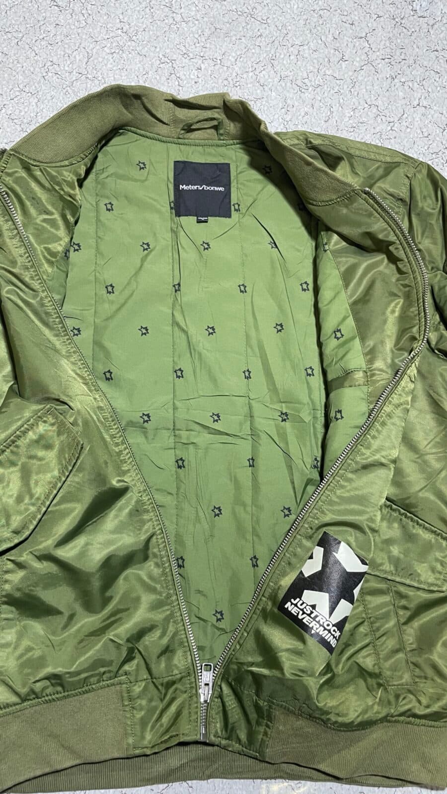 Branded thrift bomber jacket India close-up