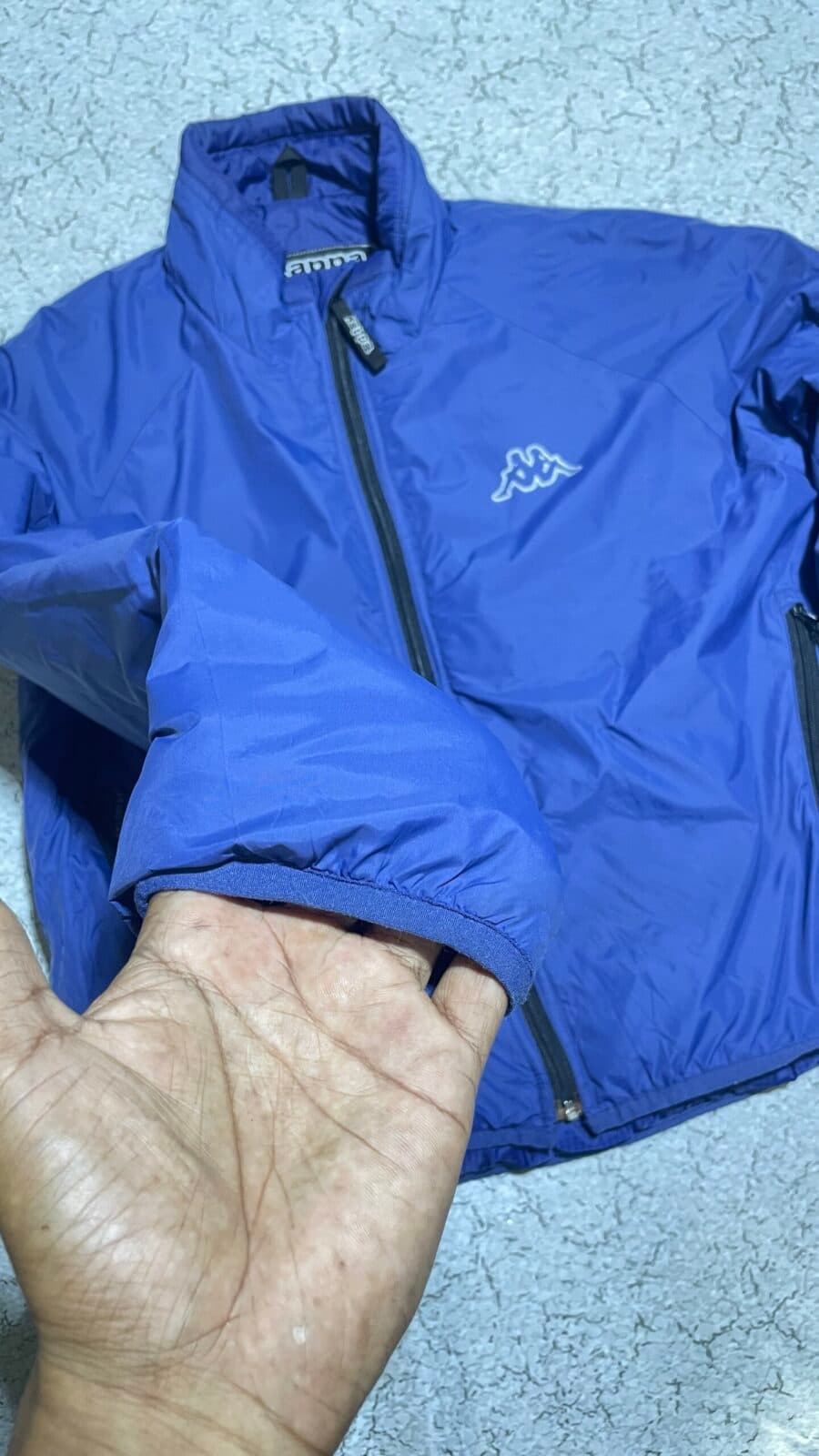 Branded thrift puffer jacket India close-up