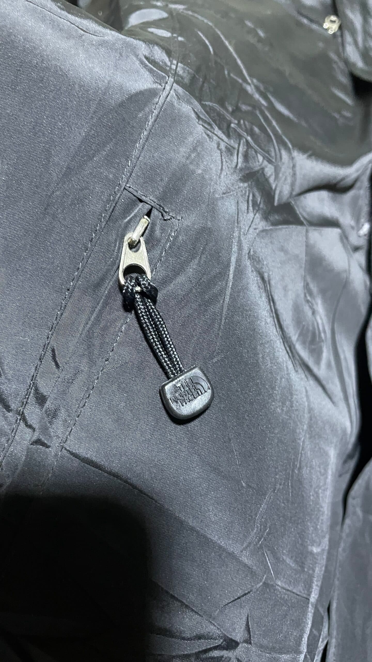 The North Face thrift windbreaker jacket India close-up