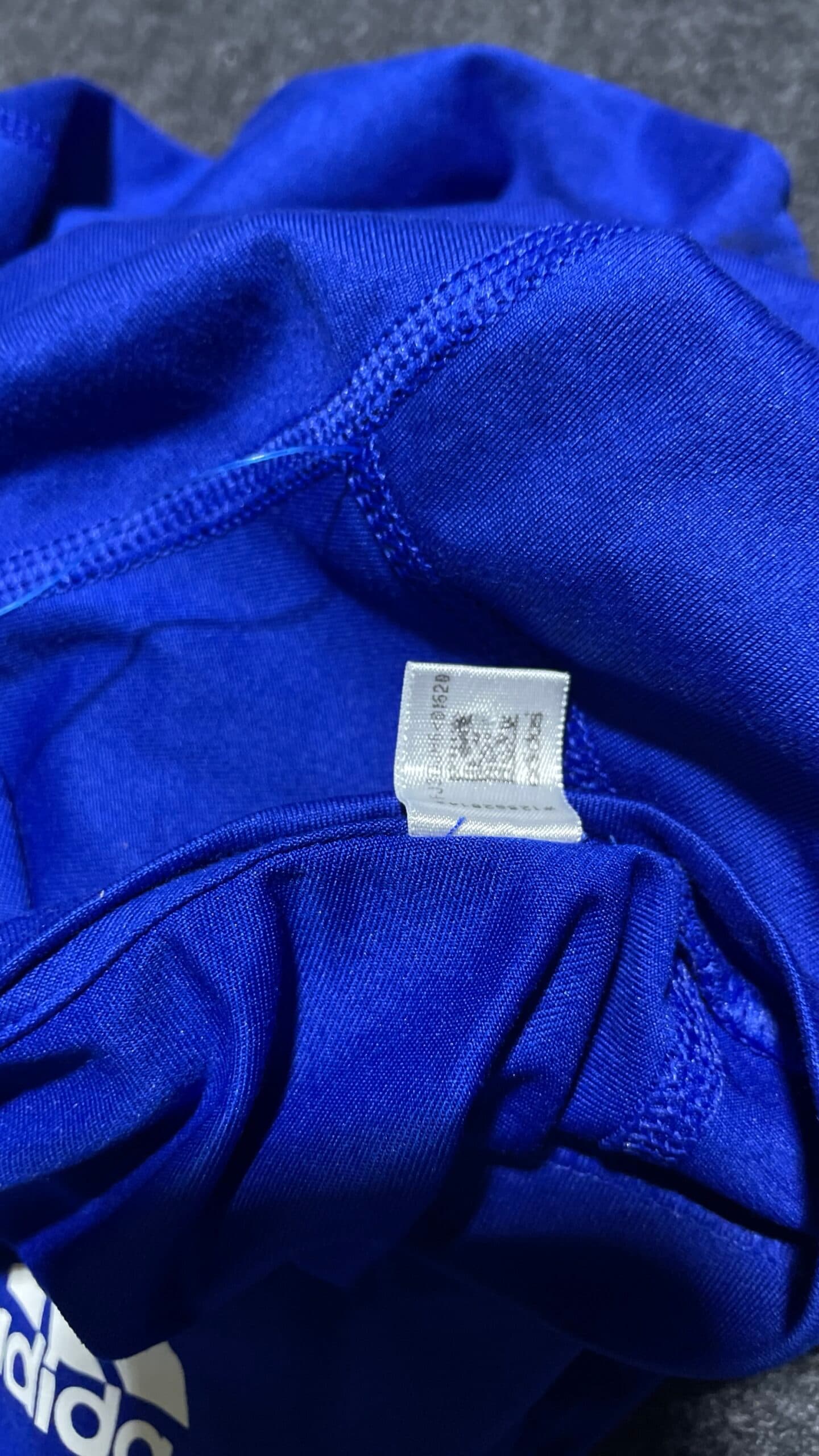 Adidas thrift clothing India close-up