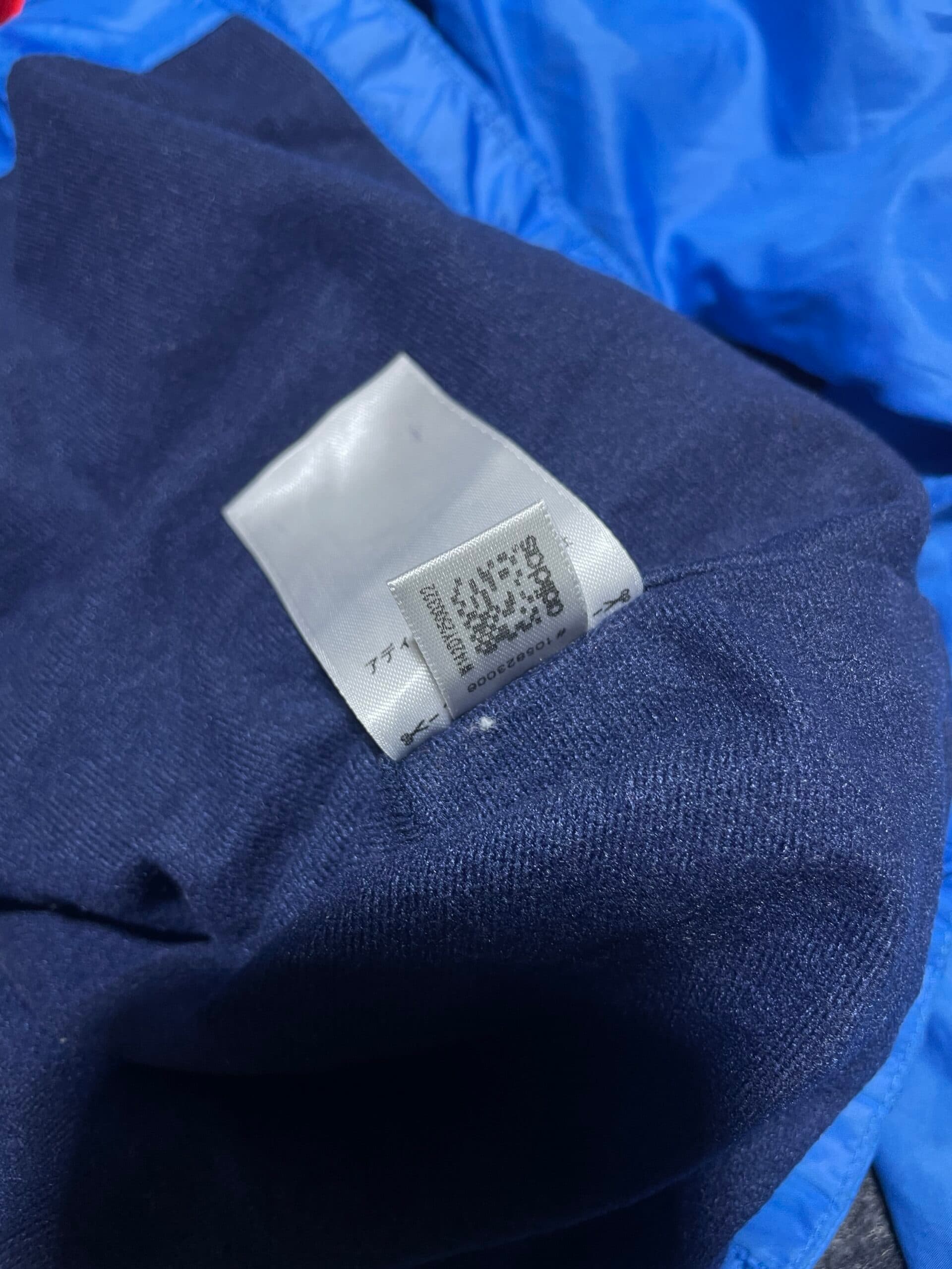 Adidas thrift waterproof jacket India close-up