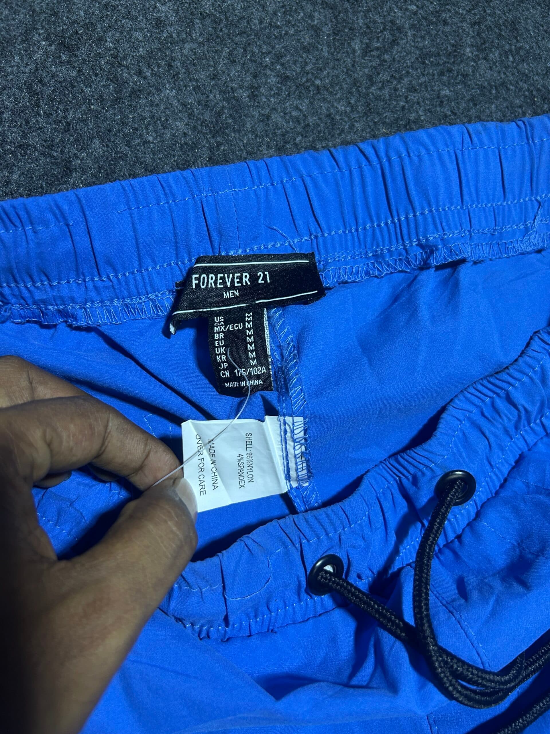 Branded thrift track pants India close-up