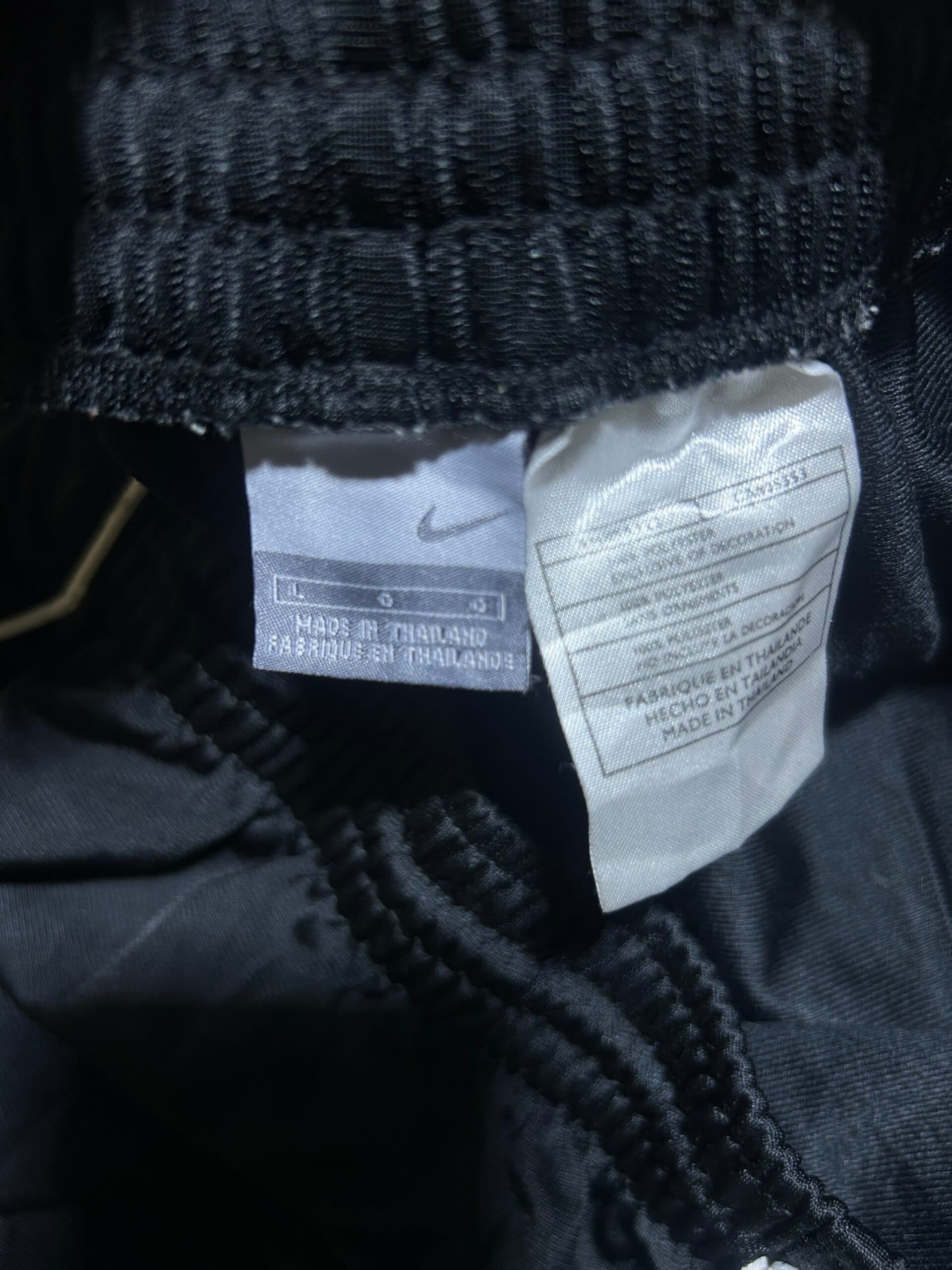 Nike thrift track pants India close-up