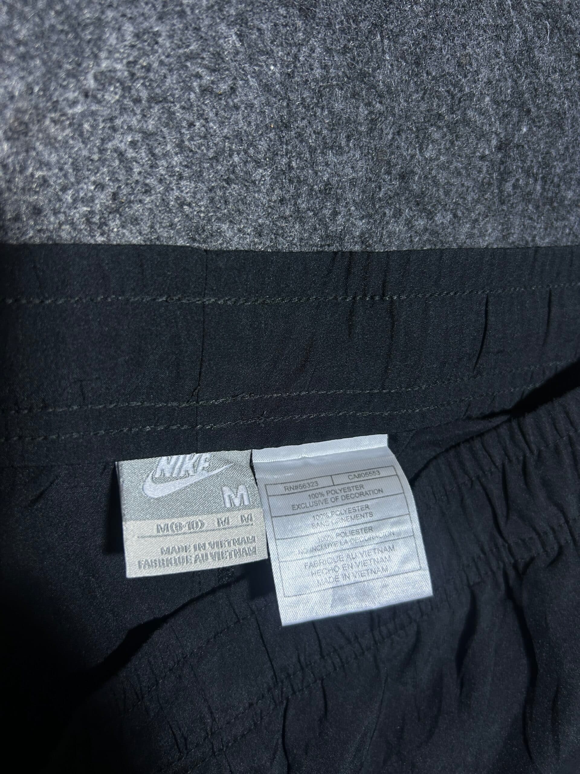 Nike thrift track pants India close-up