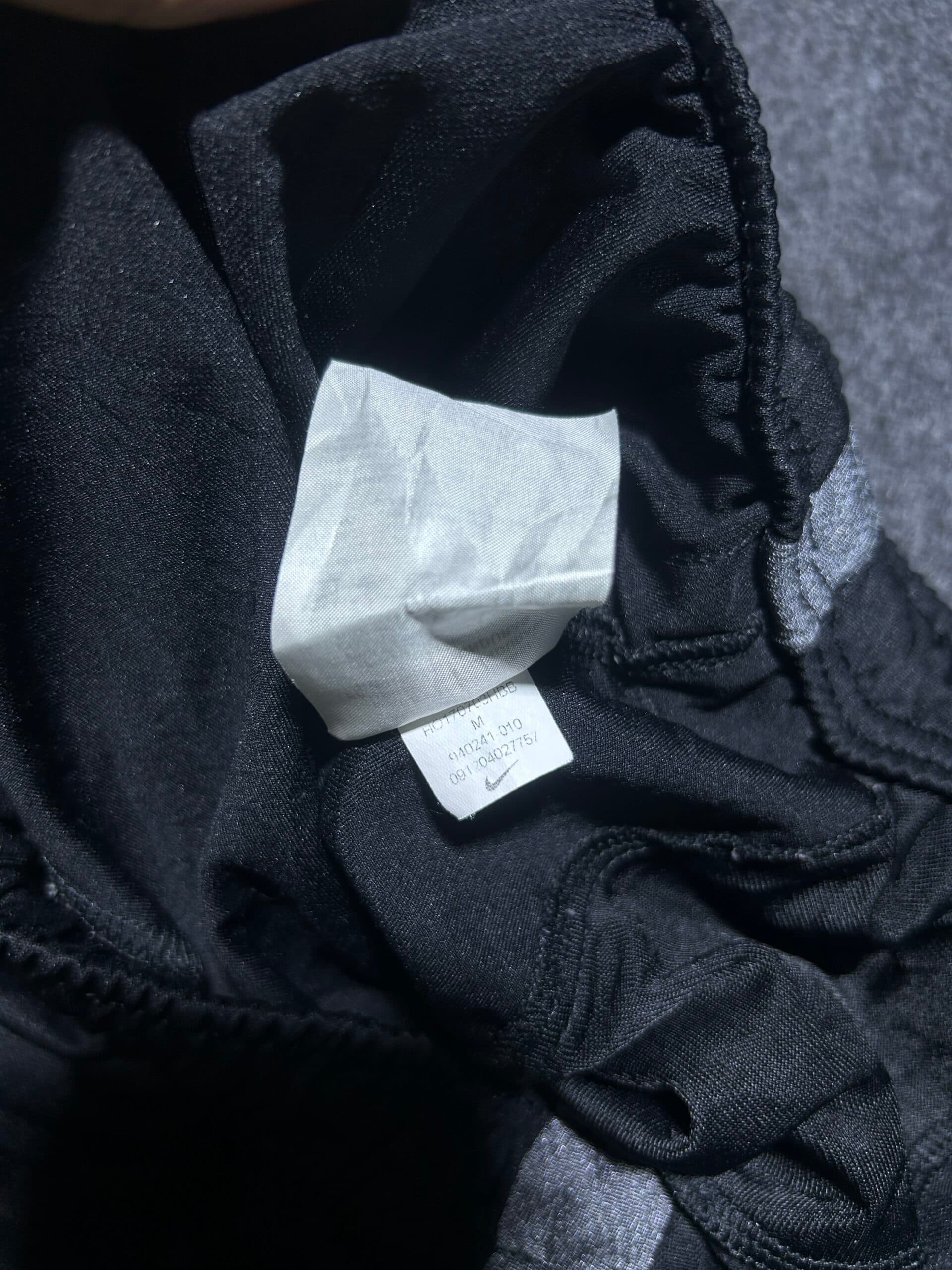 Nike thrift track pants India close-up