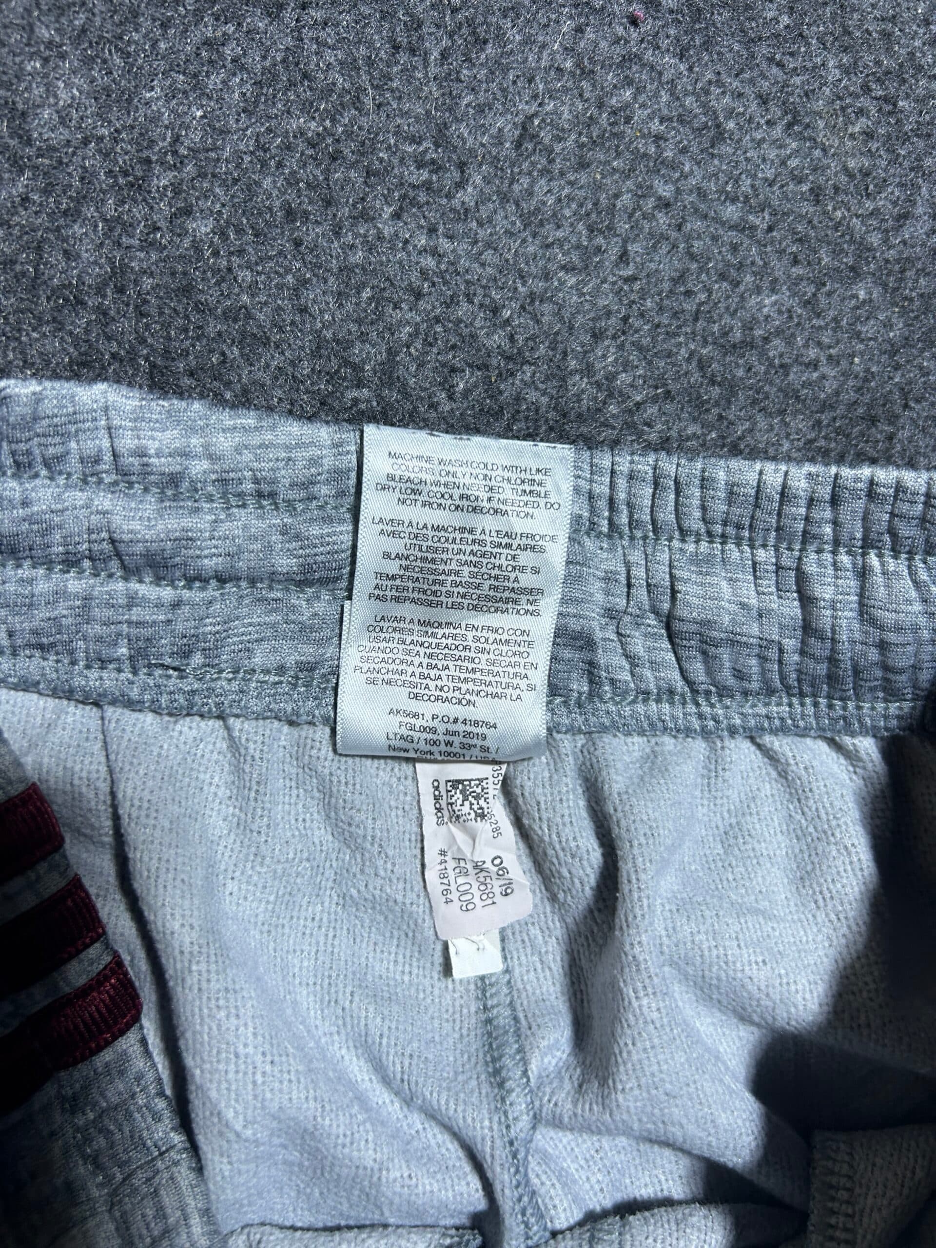 Adidas thrift track pants India close-up