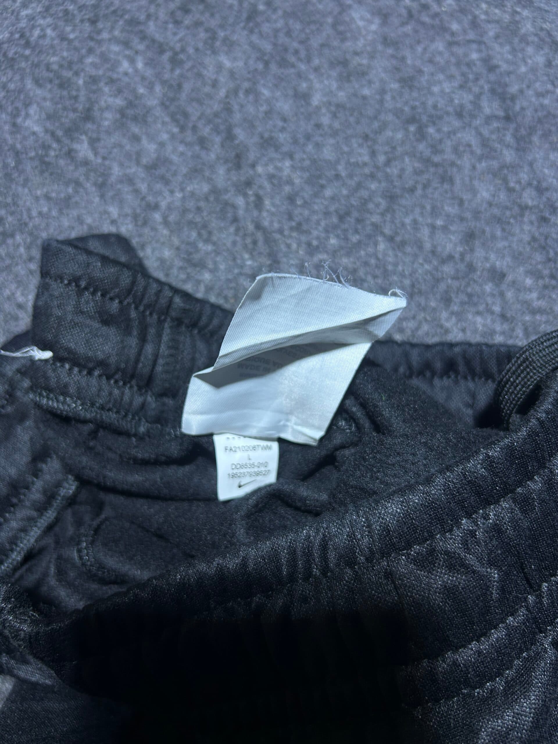 Nike thrift track pants India close-up