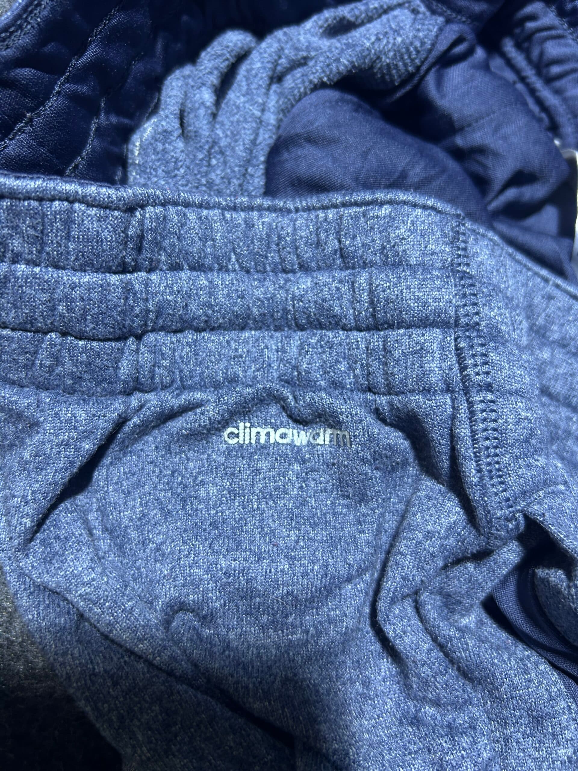 Adidas thrift track pants India close-up