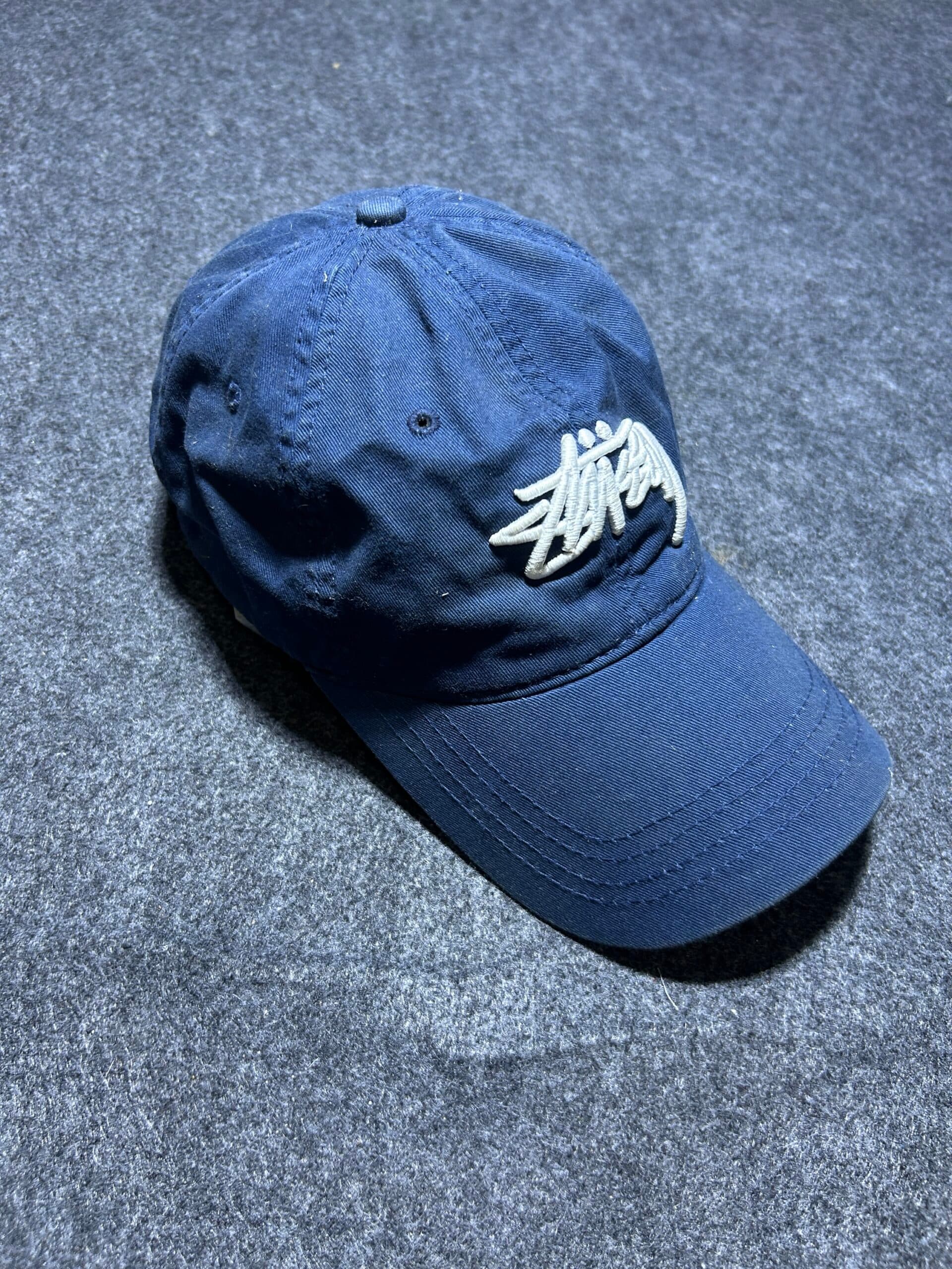Stüssy Logo Embroidered Navy Blue Cap | Adjustable Streetwear Hat thrift clothing India detail view