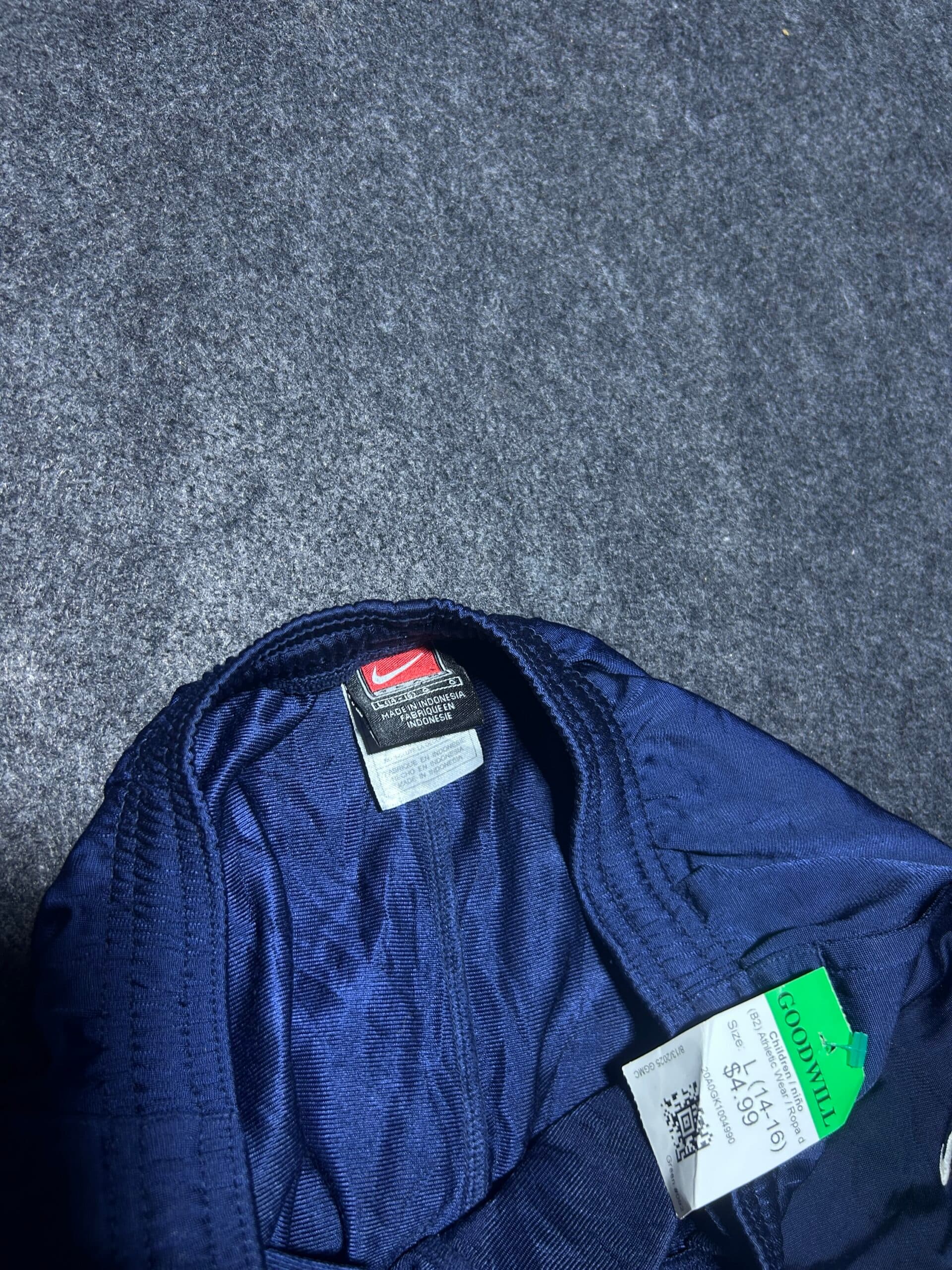 Nike thrift track pants India close-up