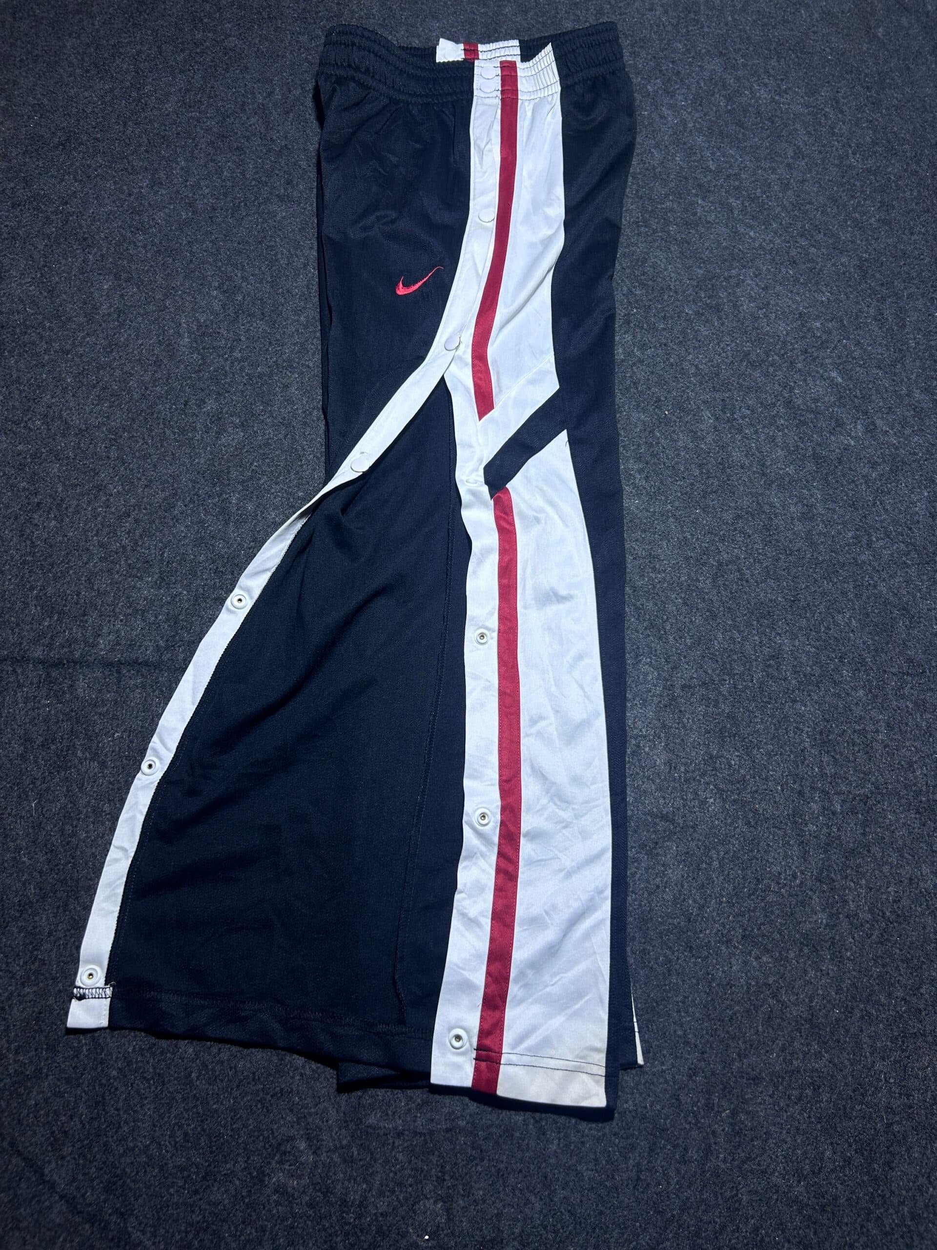Nike thrift track pants India close-up