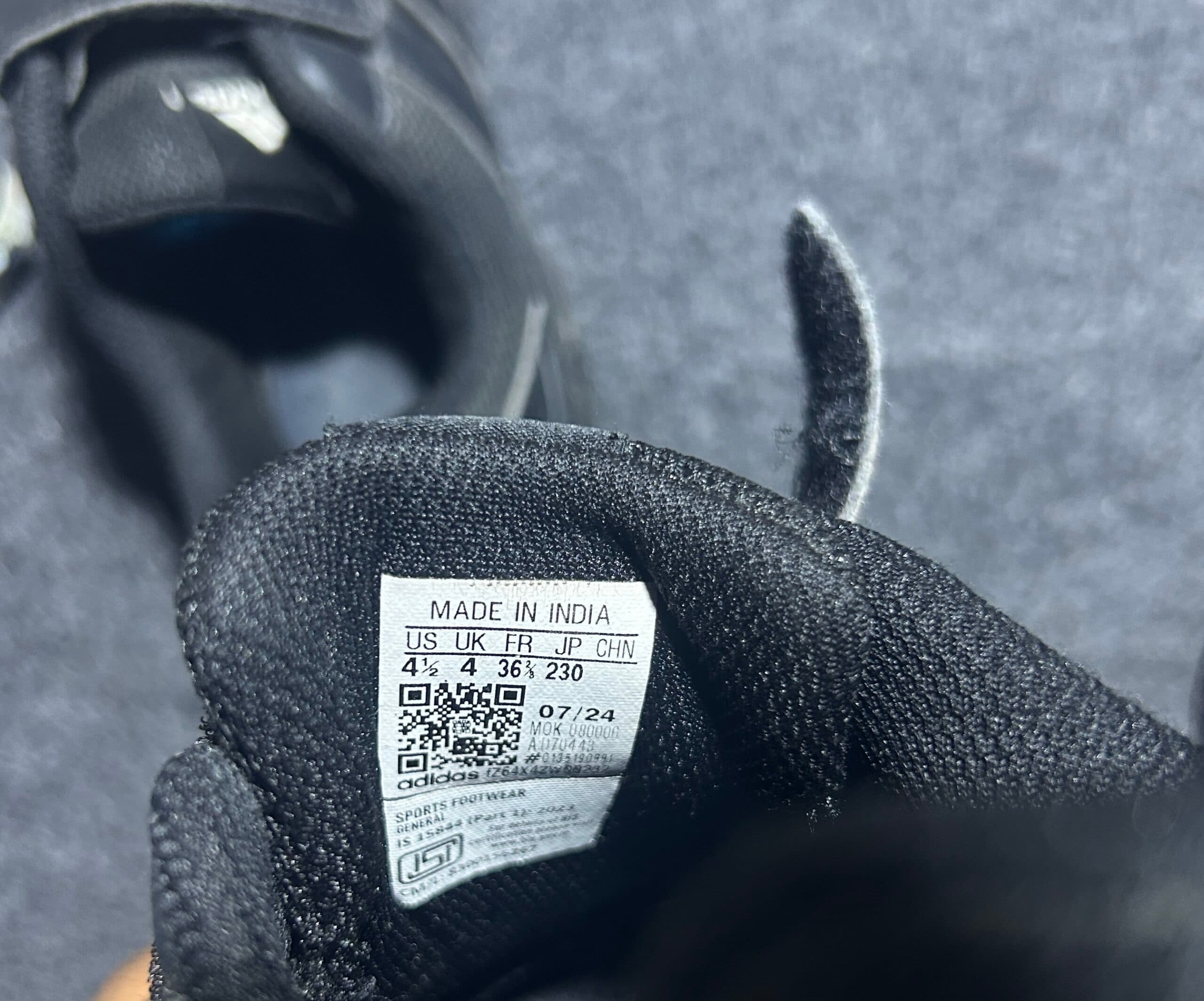 Adidas thrift sneakers India close-up