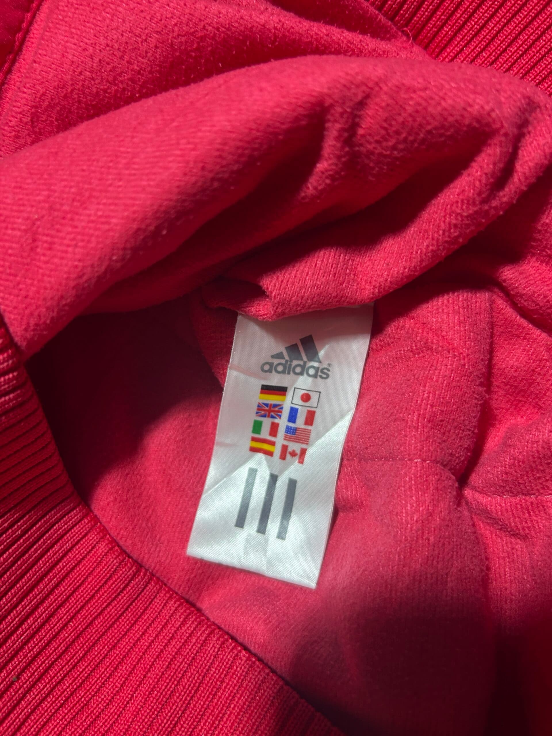 Adidas thrift jacket India close-up