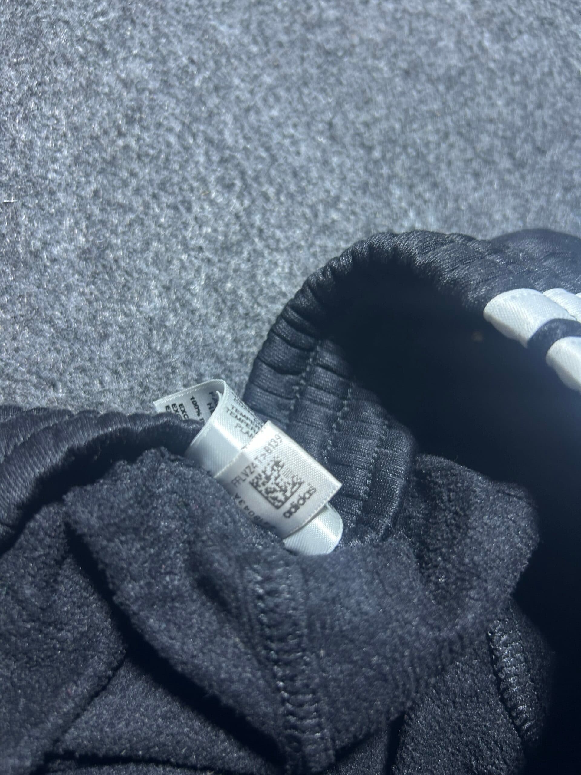 Adidas thrift track pants India close-up