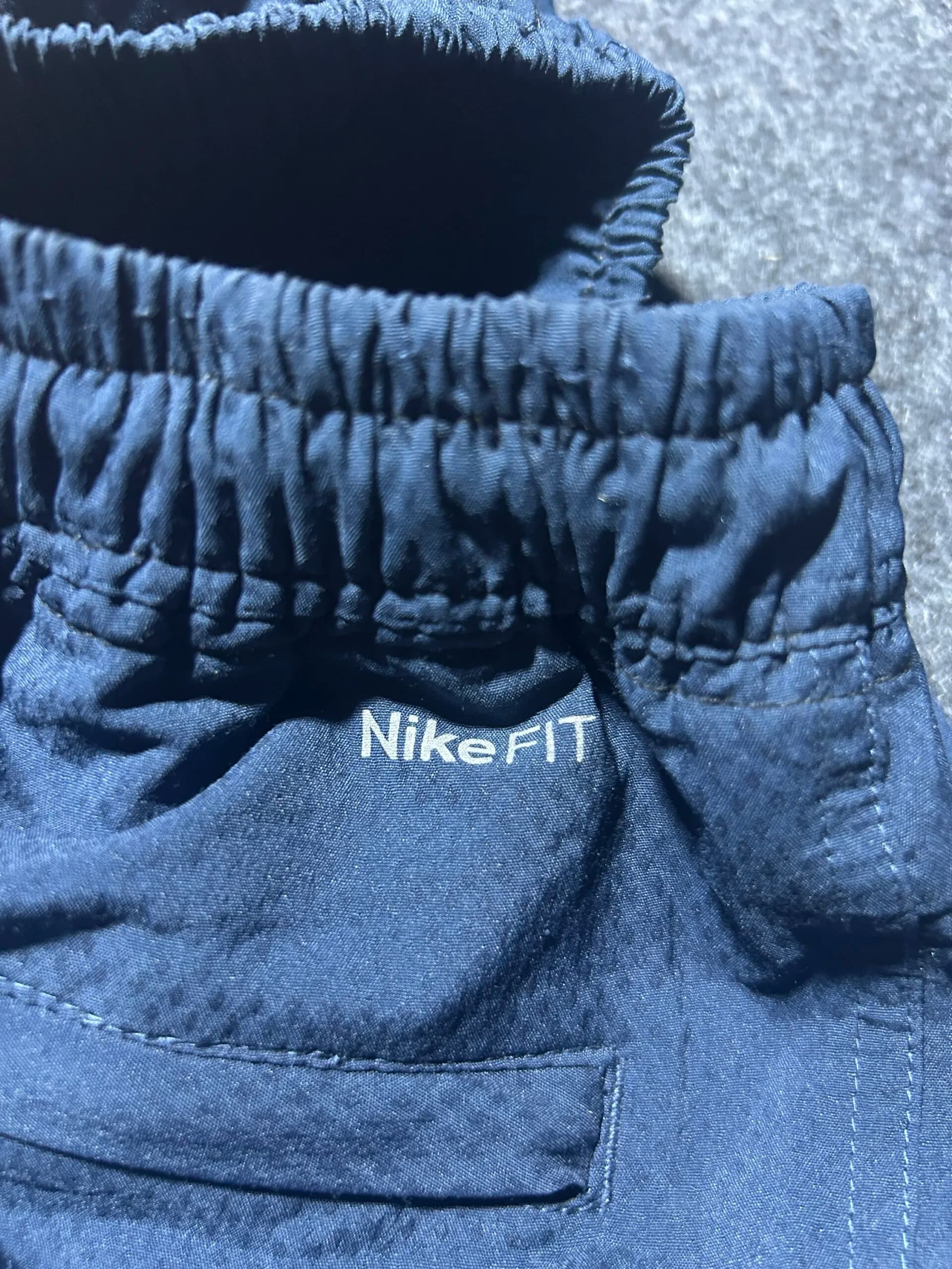 Nike thrift track pants India close-up