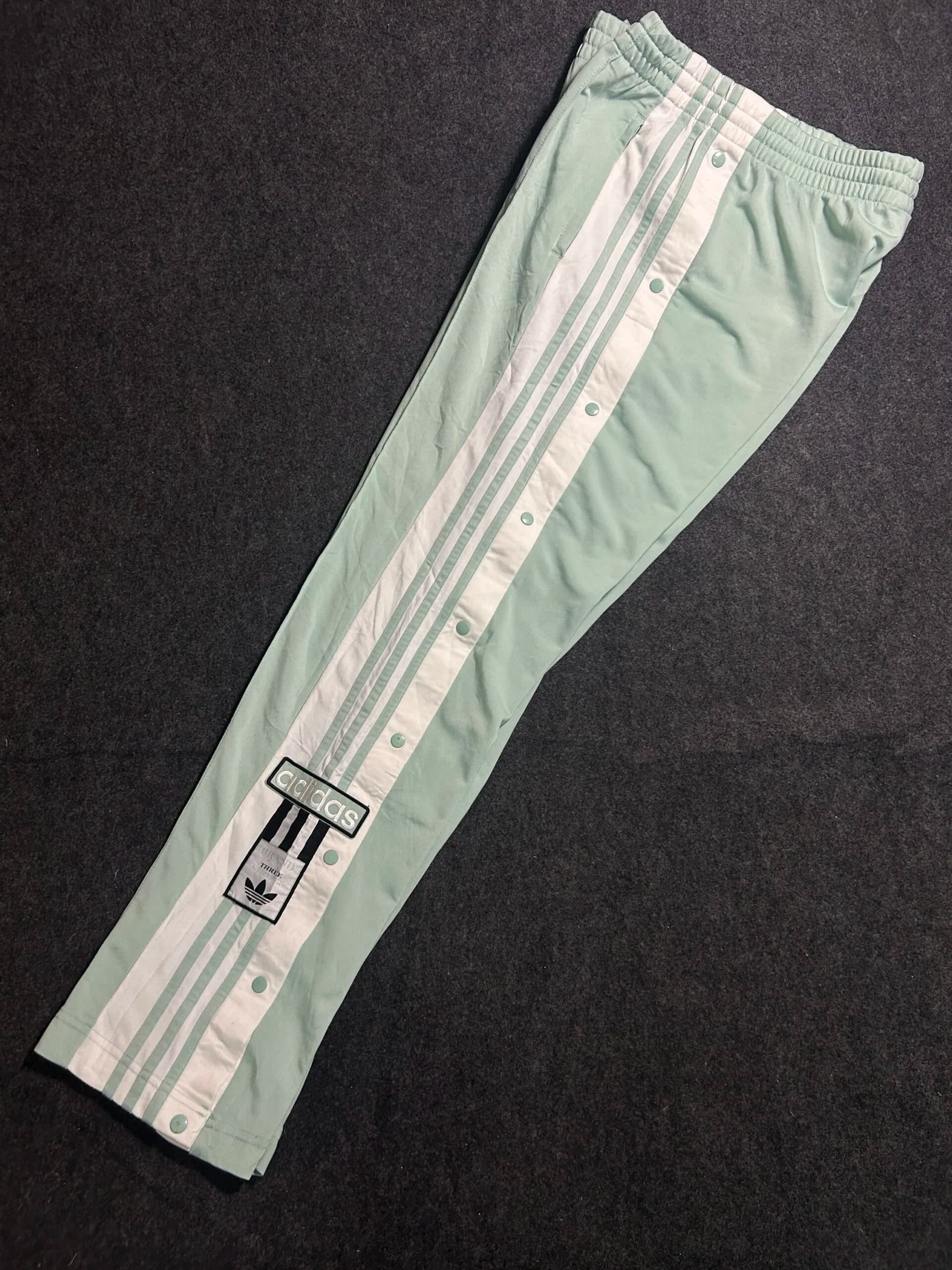 Adidas thrift track pants India close-up