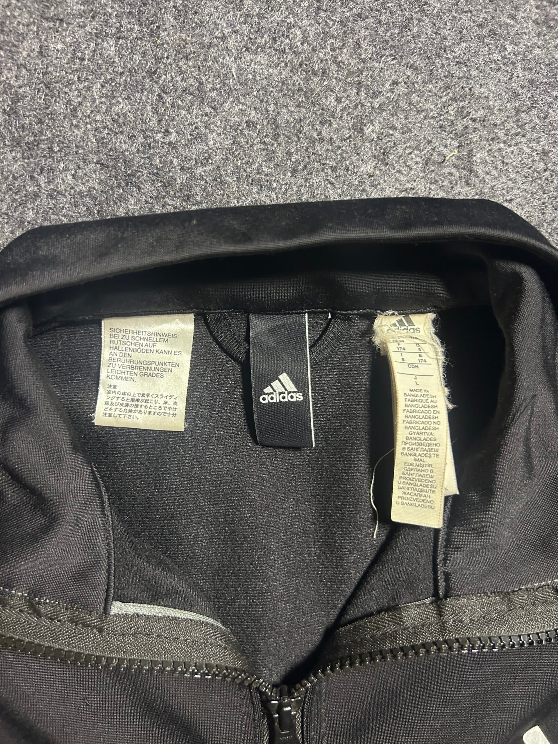 Adidas thrift track jacket India close-up