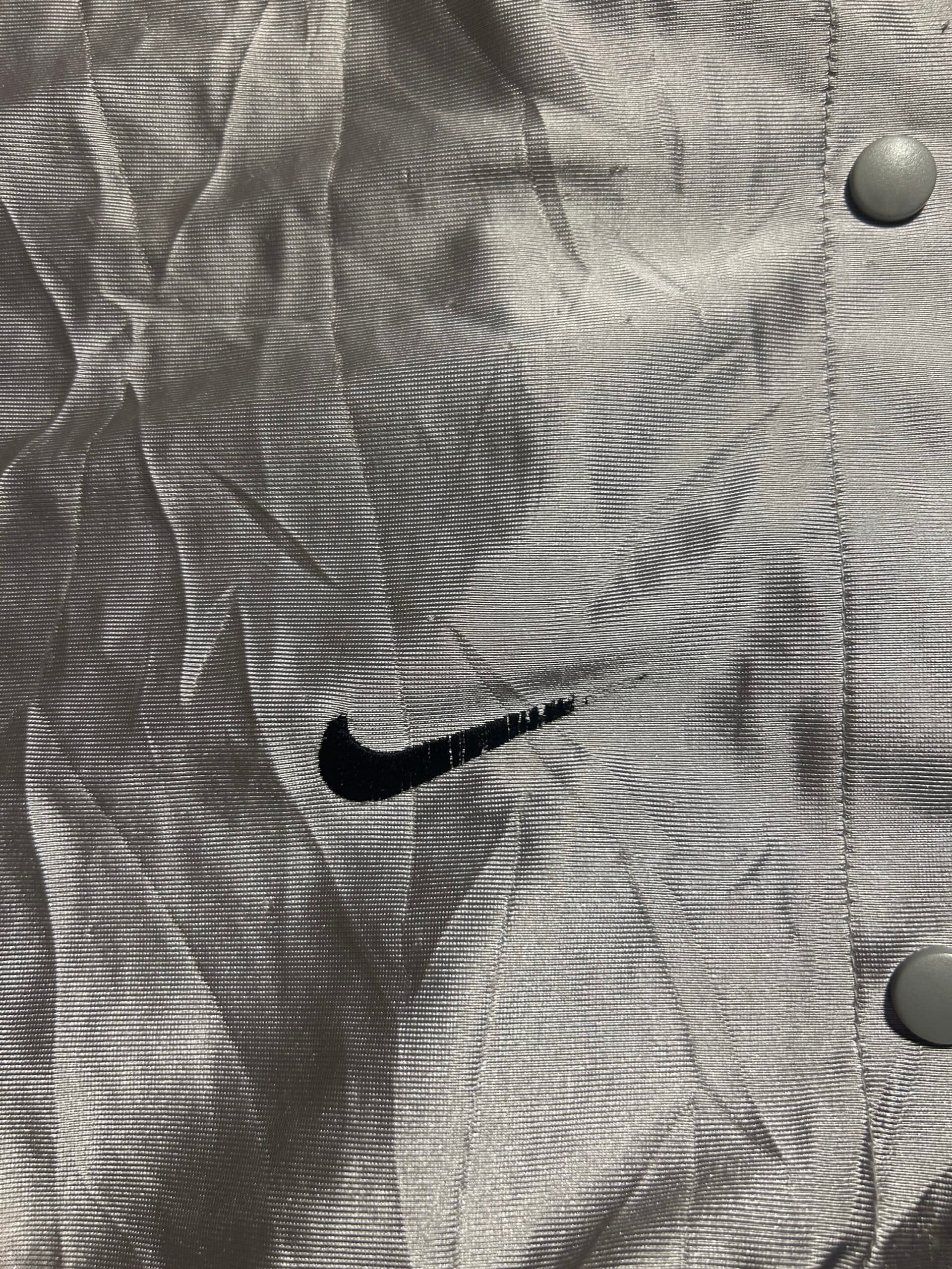 Nike thrift track pants India close-up