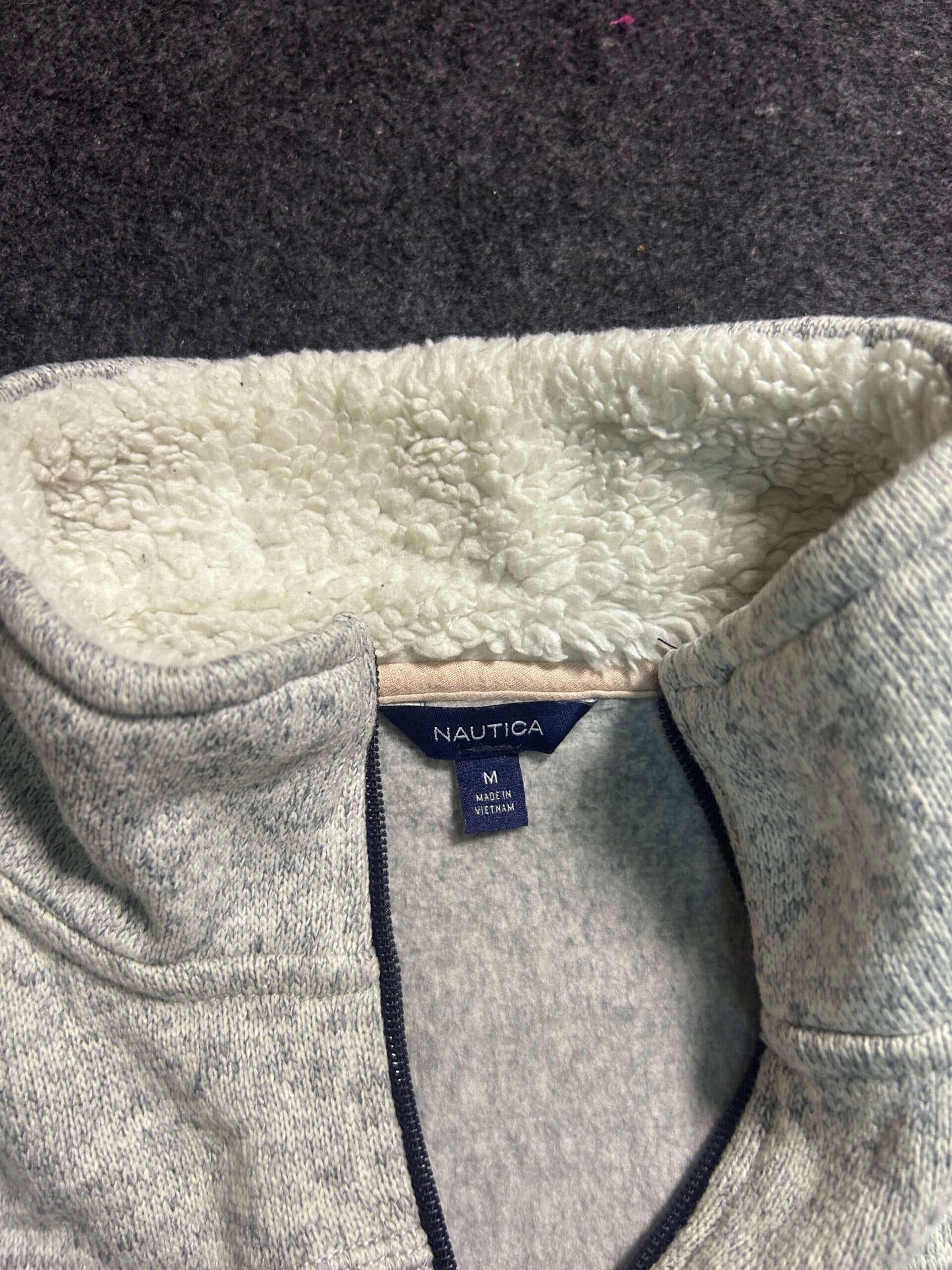 Branded thrift fleece jacket India close-up