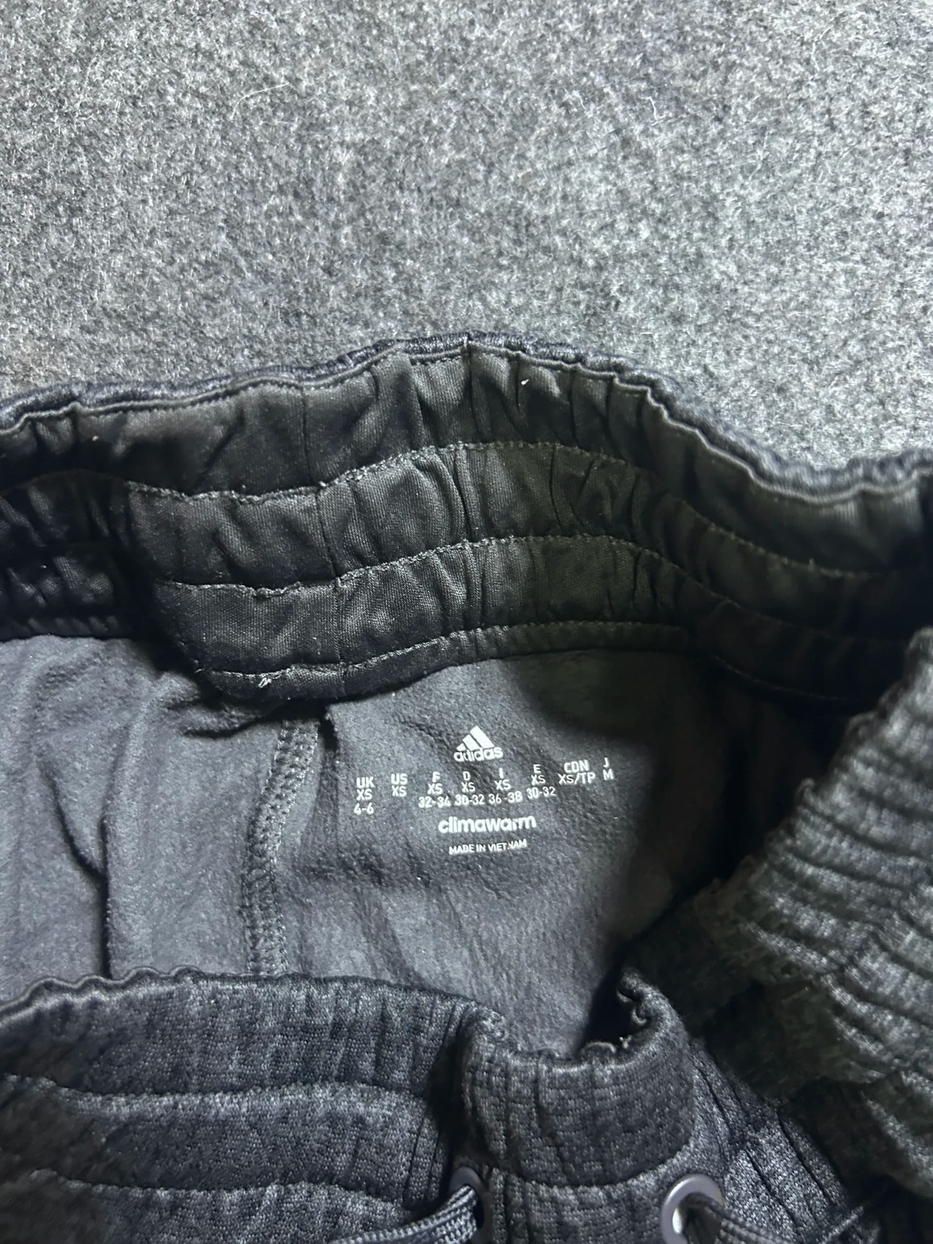 Adidas thrift track pants India close-up