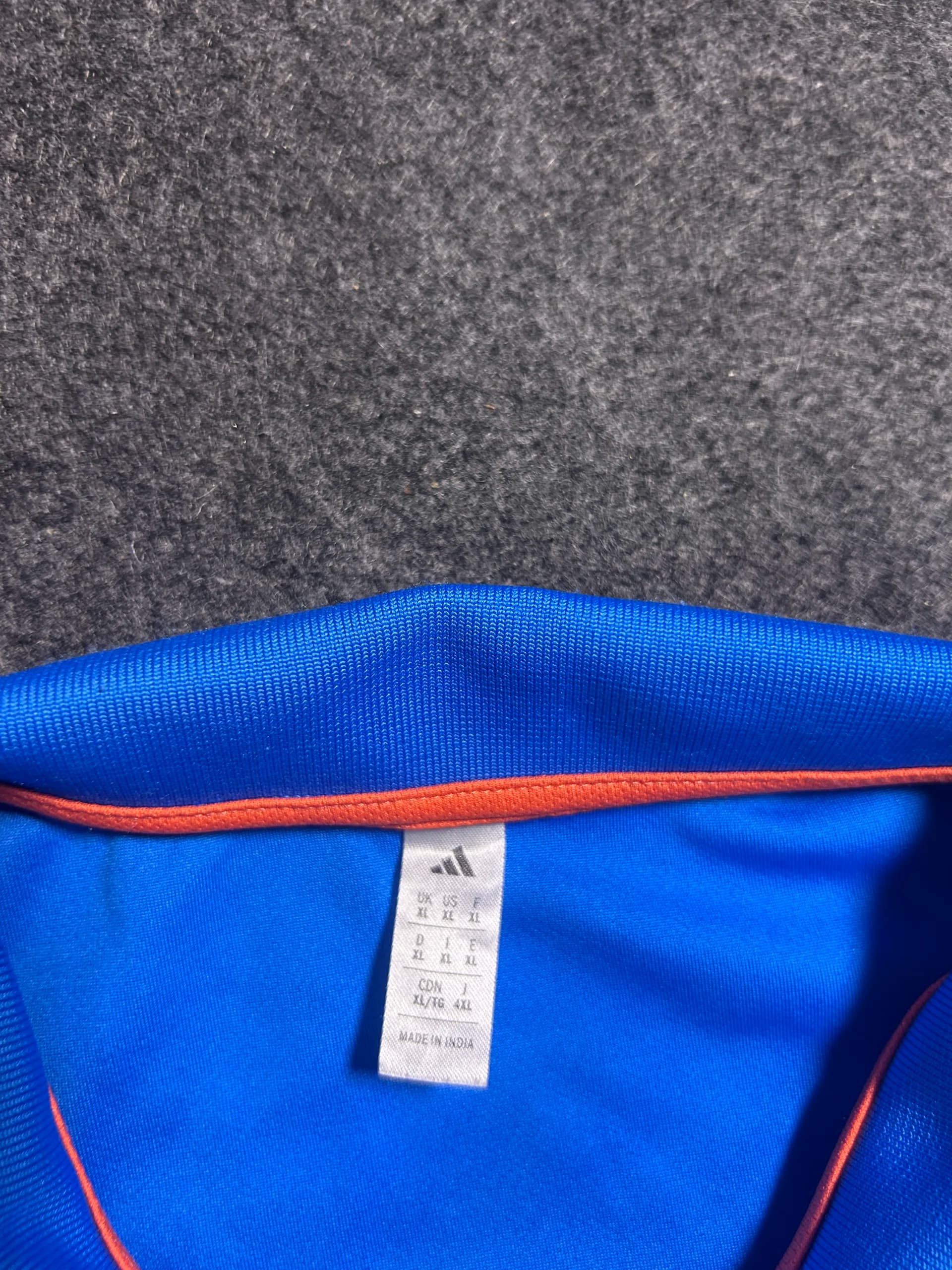 Adidas thrift polo shirt India close-up