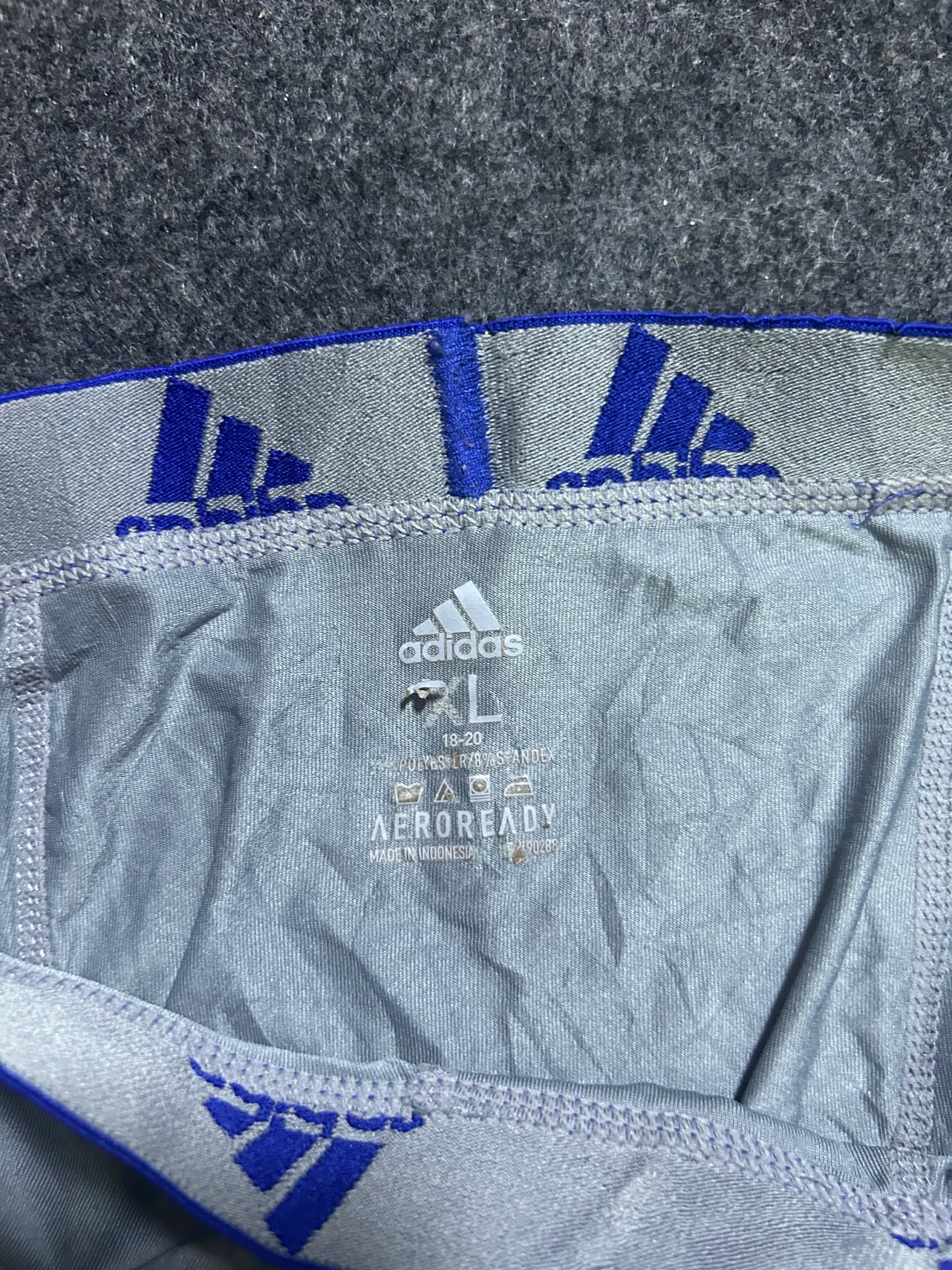 Adidas thrift shorts India close-up
