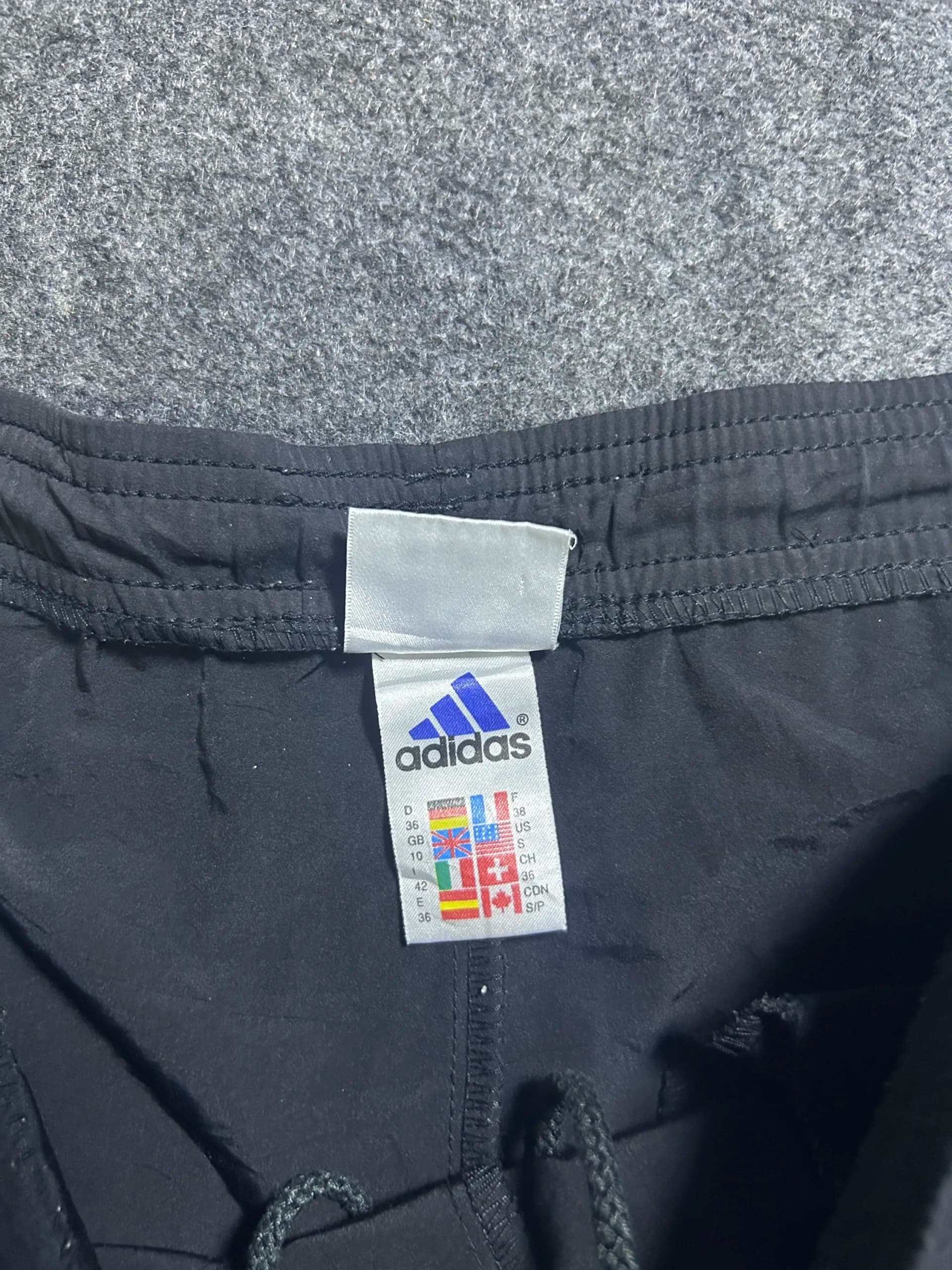 Adidas thrift shorts India close-up