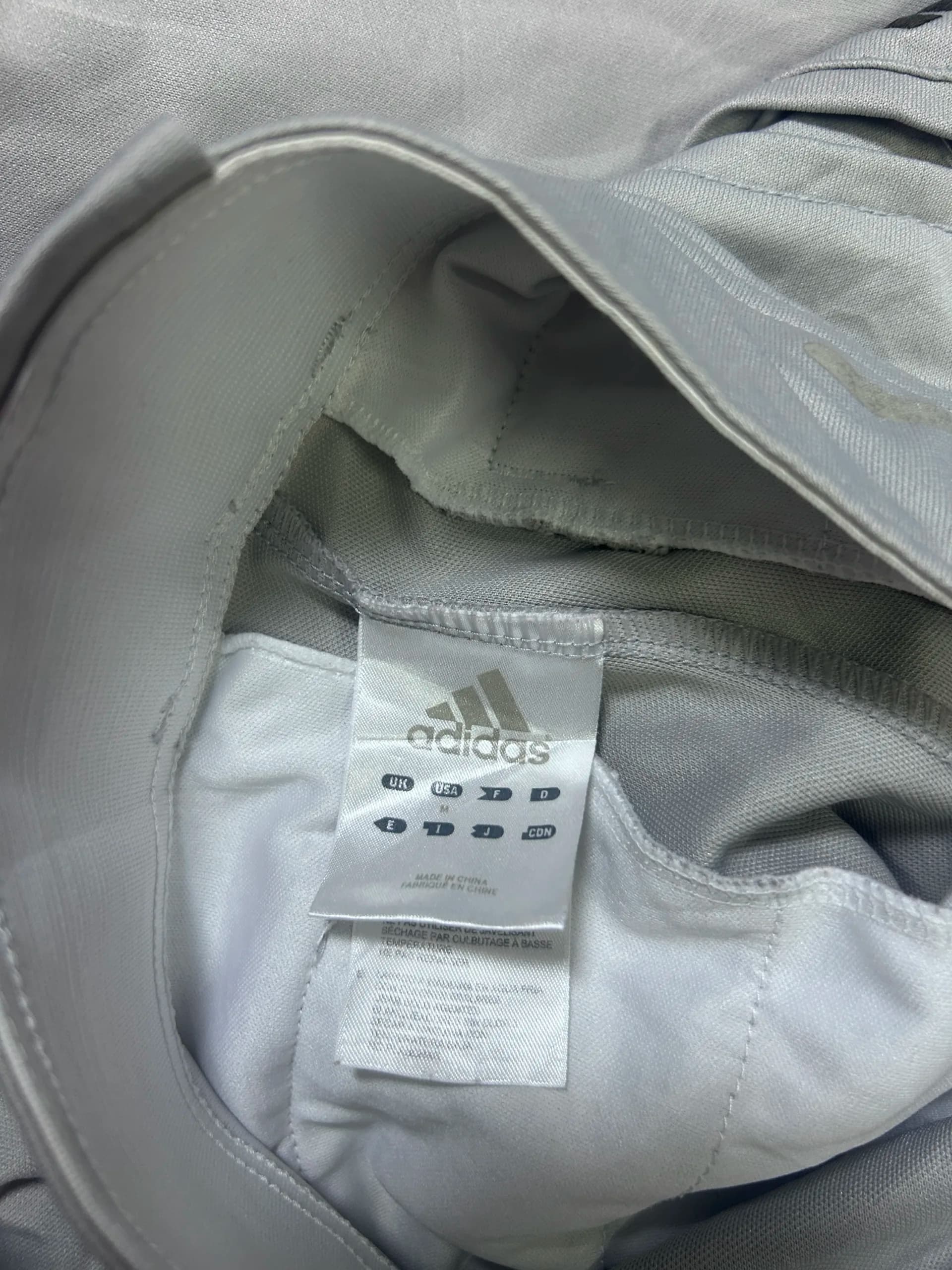 Adidas thrift trousers India close-up