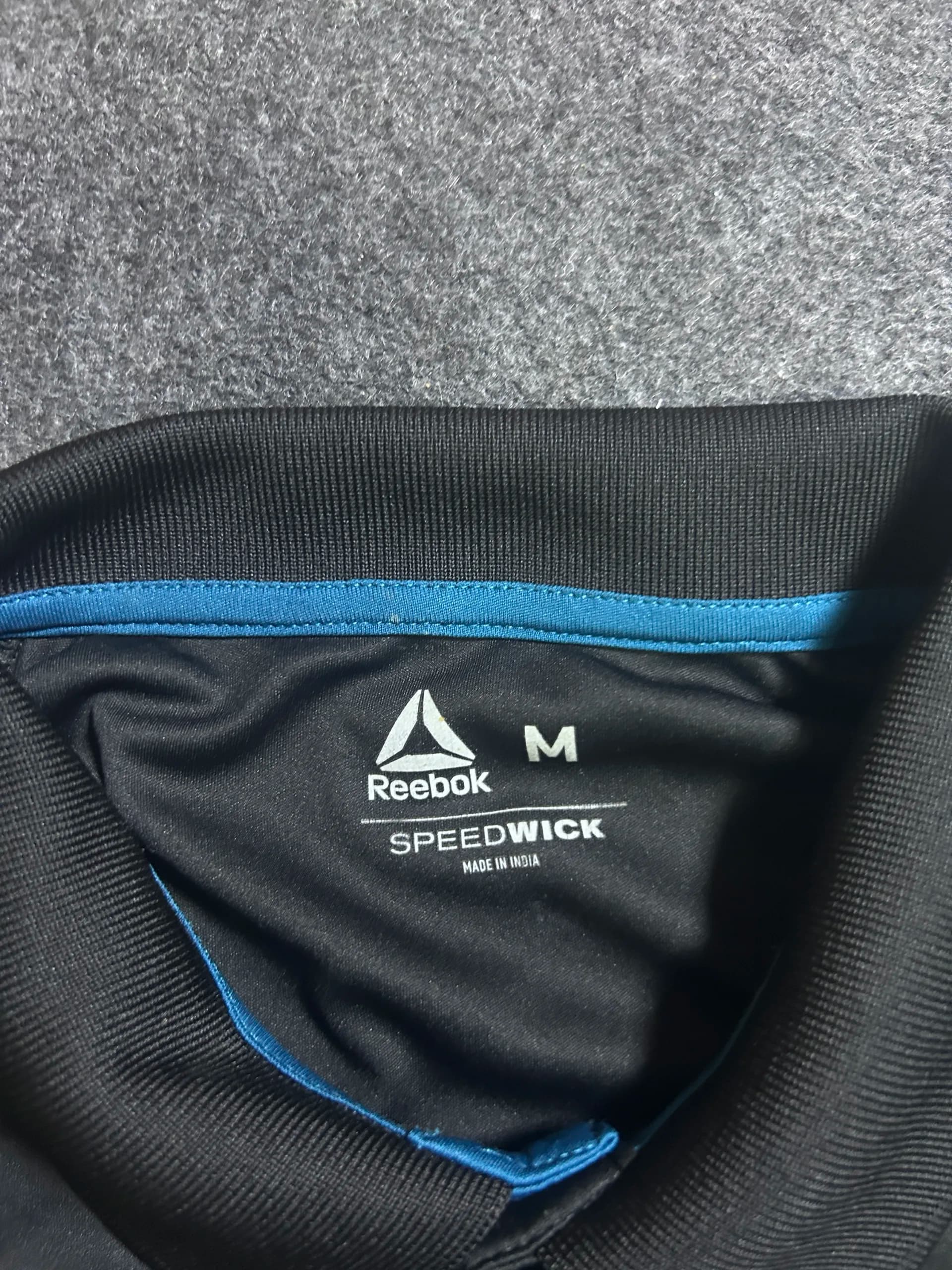 Reebok thrift polo shirt India detail view