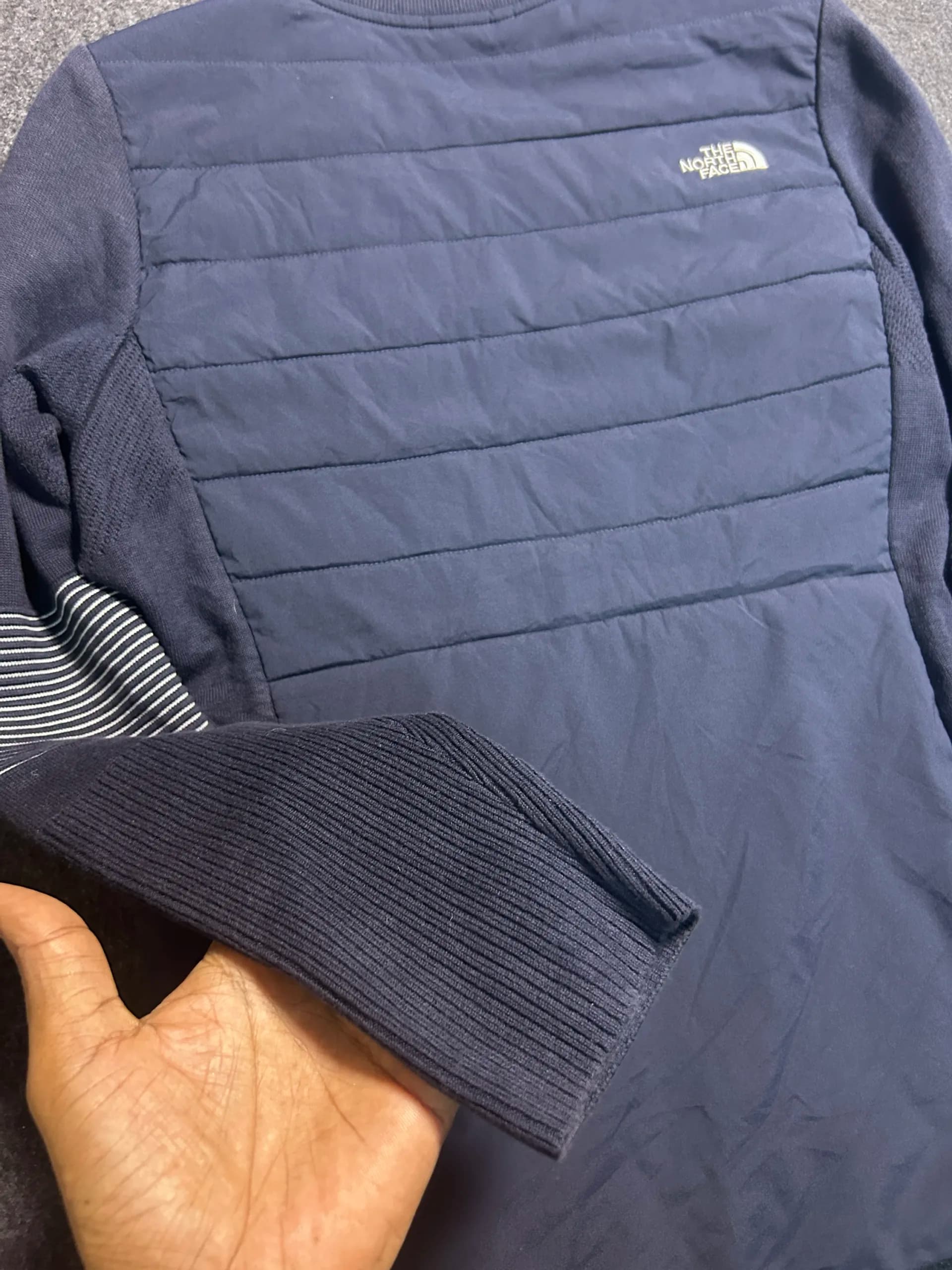 The North Face thrift bomber jacket India close-up