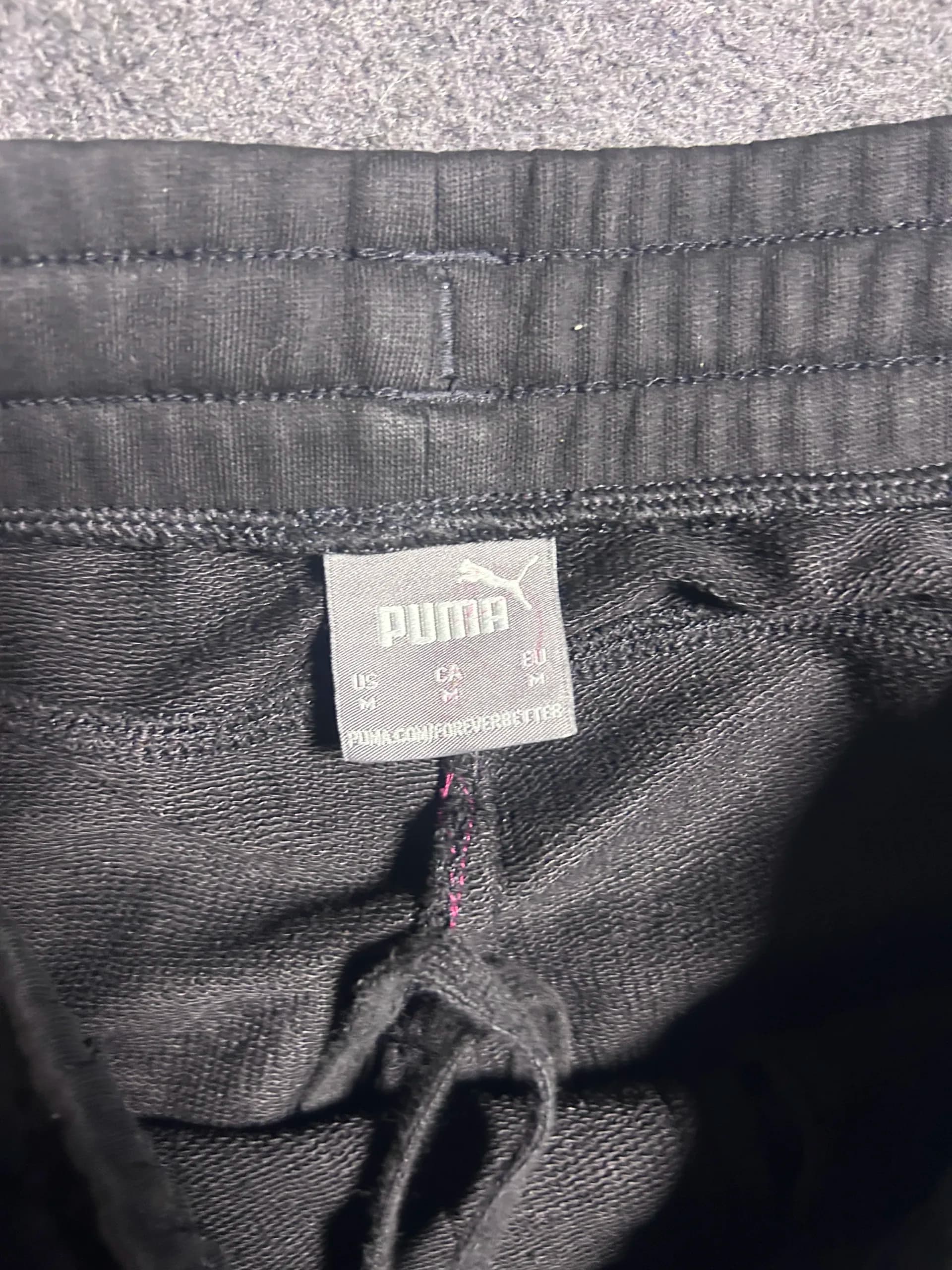 Puma thrift track pants India close-up