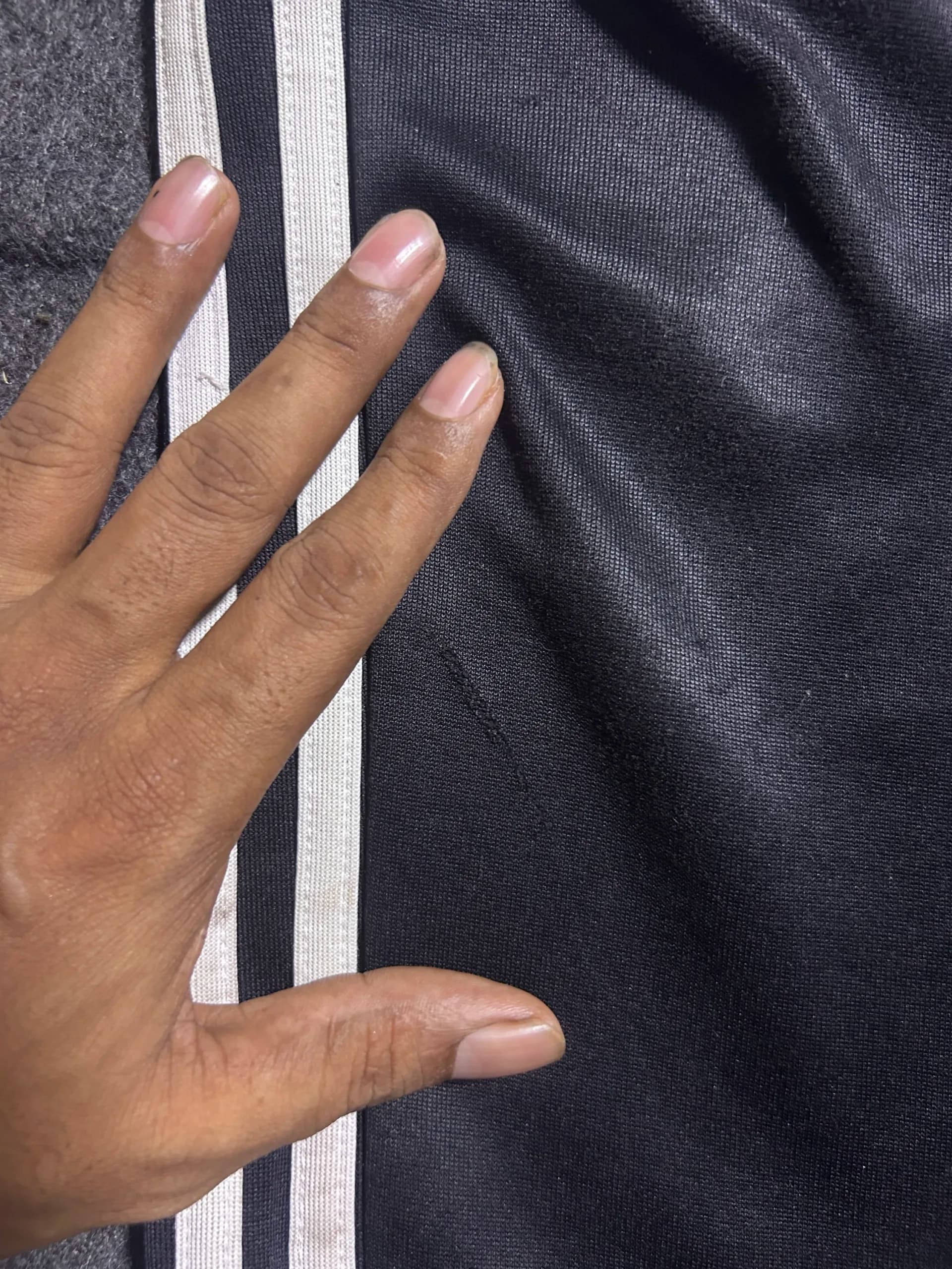 Adidas thrift track pants India close-up