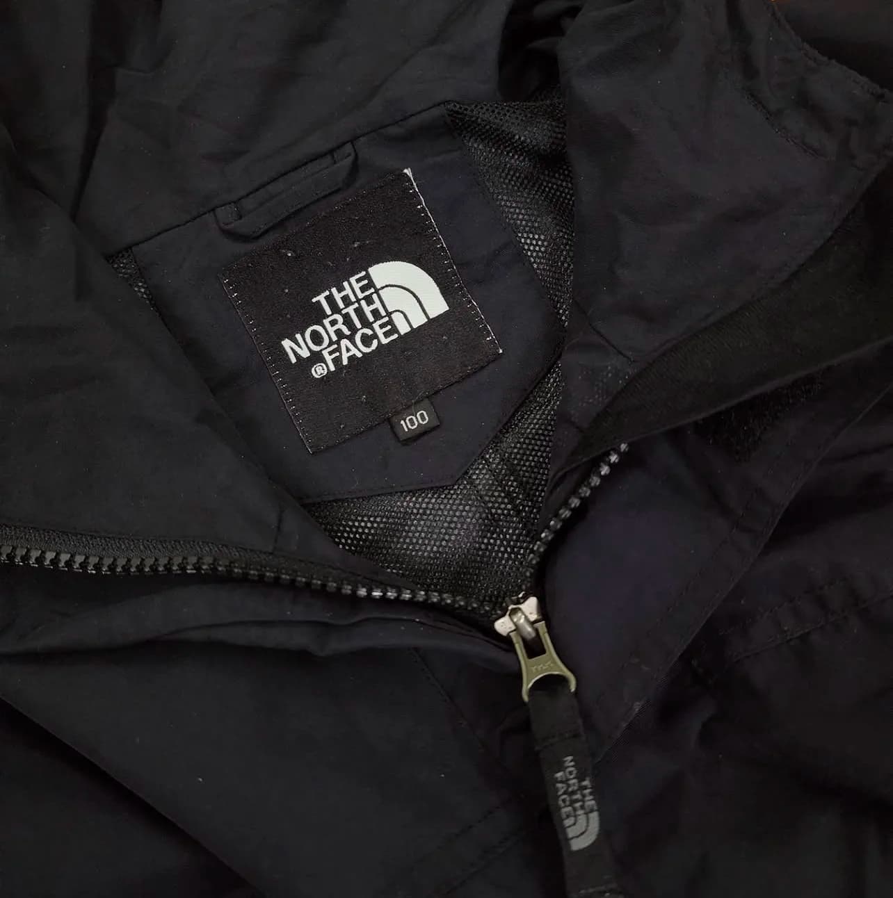 The North Face thrift windbreaker jacket India close-up
