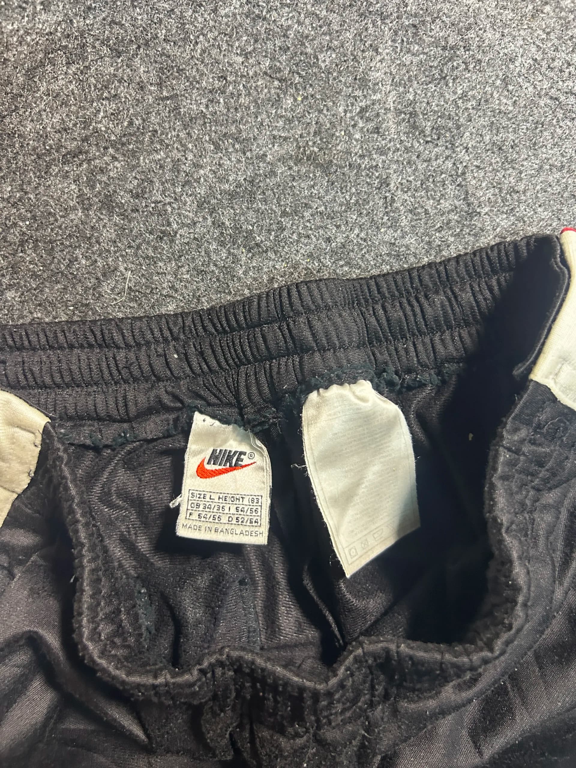 Nike thrift track pants India close-up