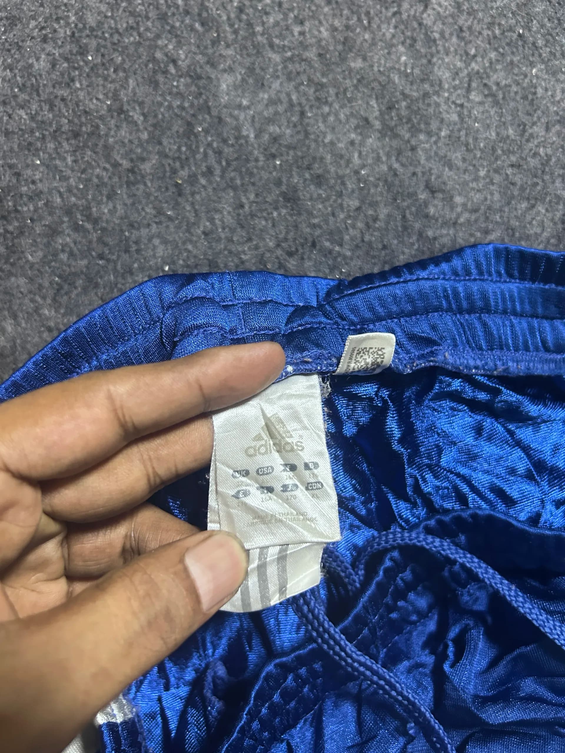 Adidas thrift track pants India close-up