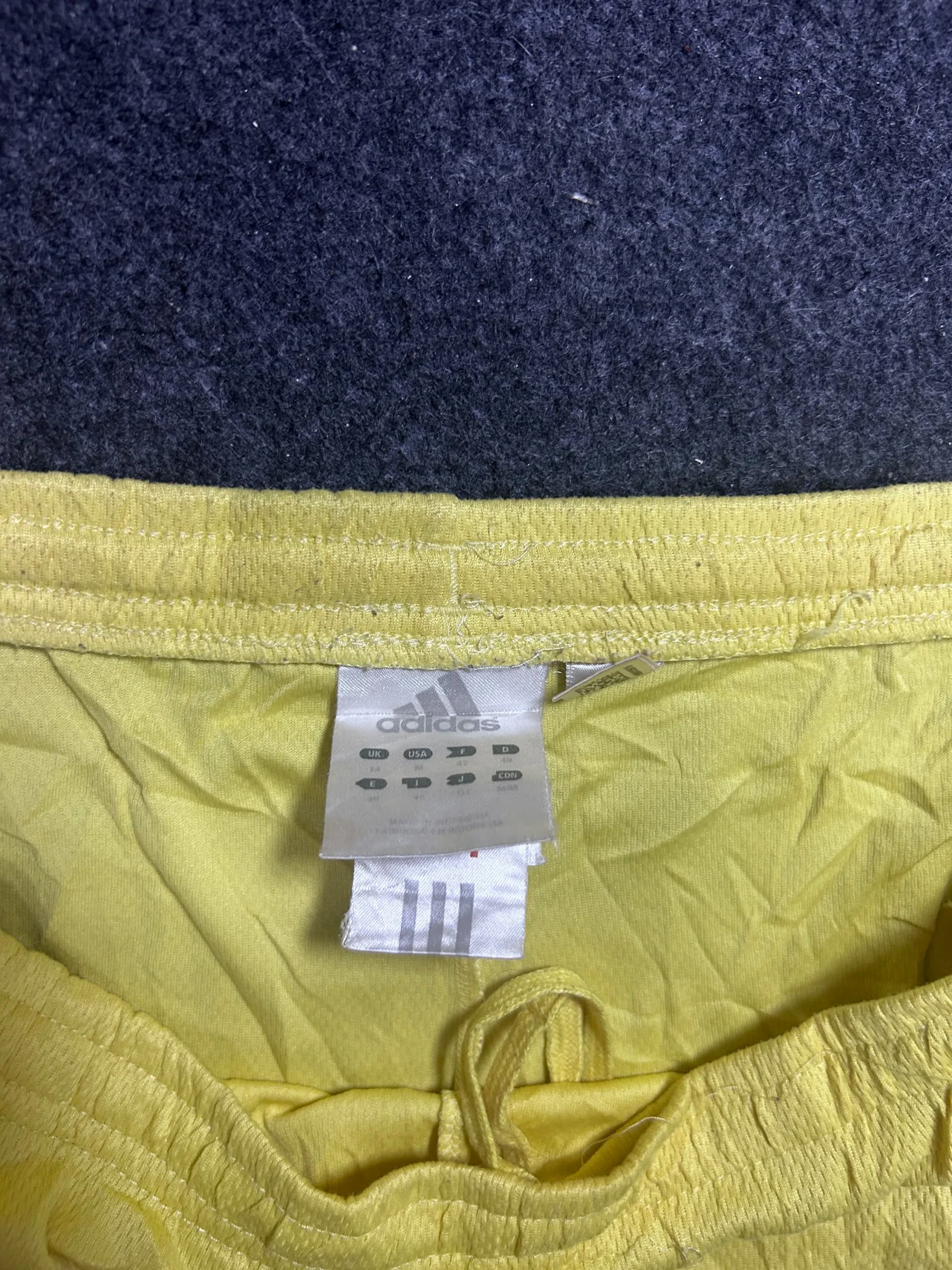 Adidas thrift shorts India close-up