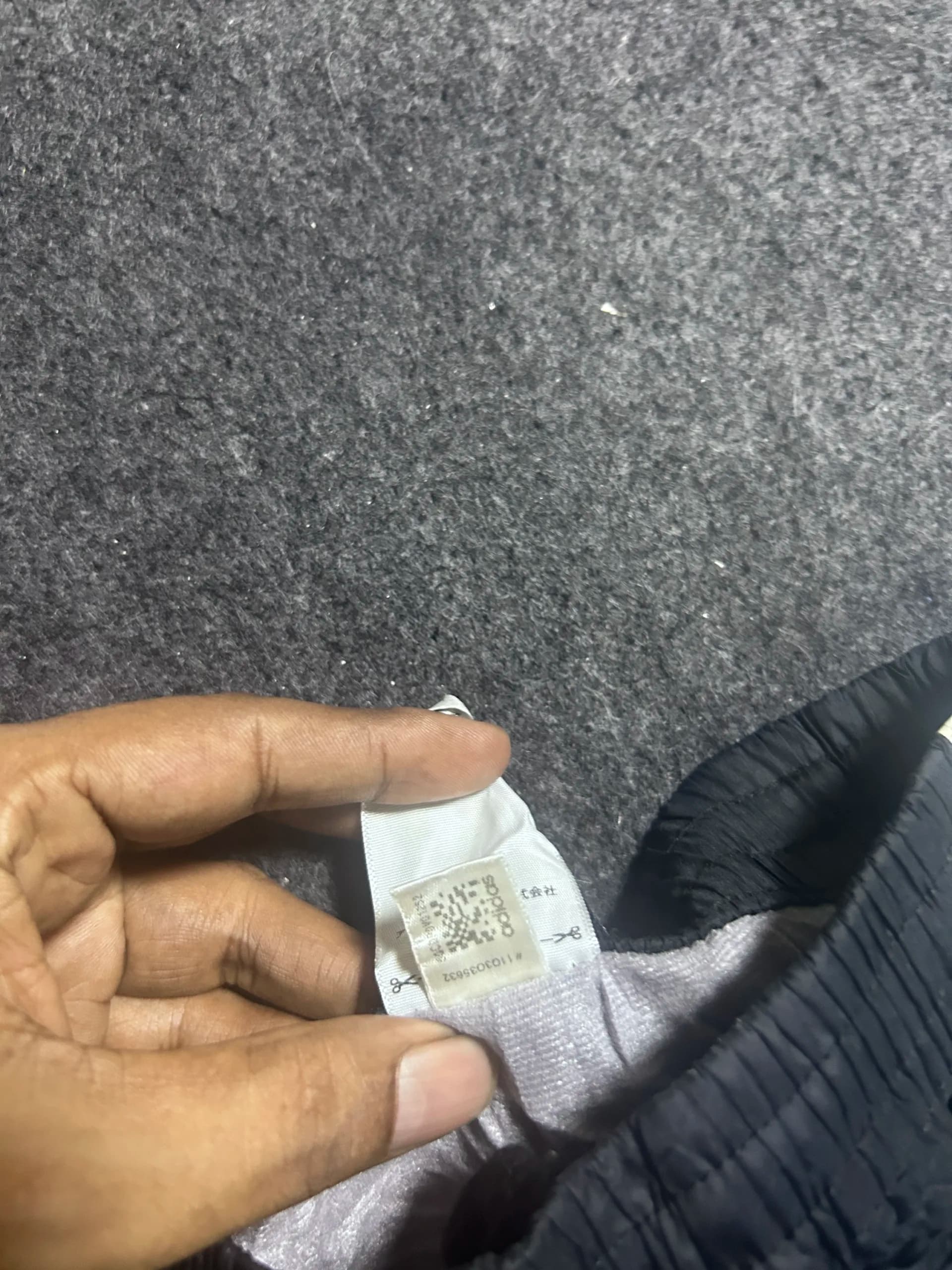 Adidas thrift shorts India close-up