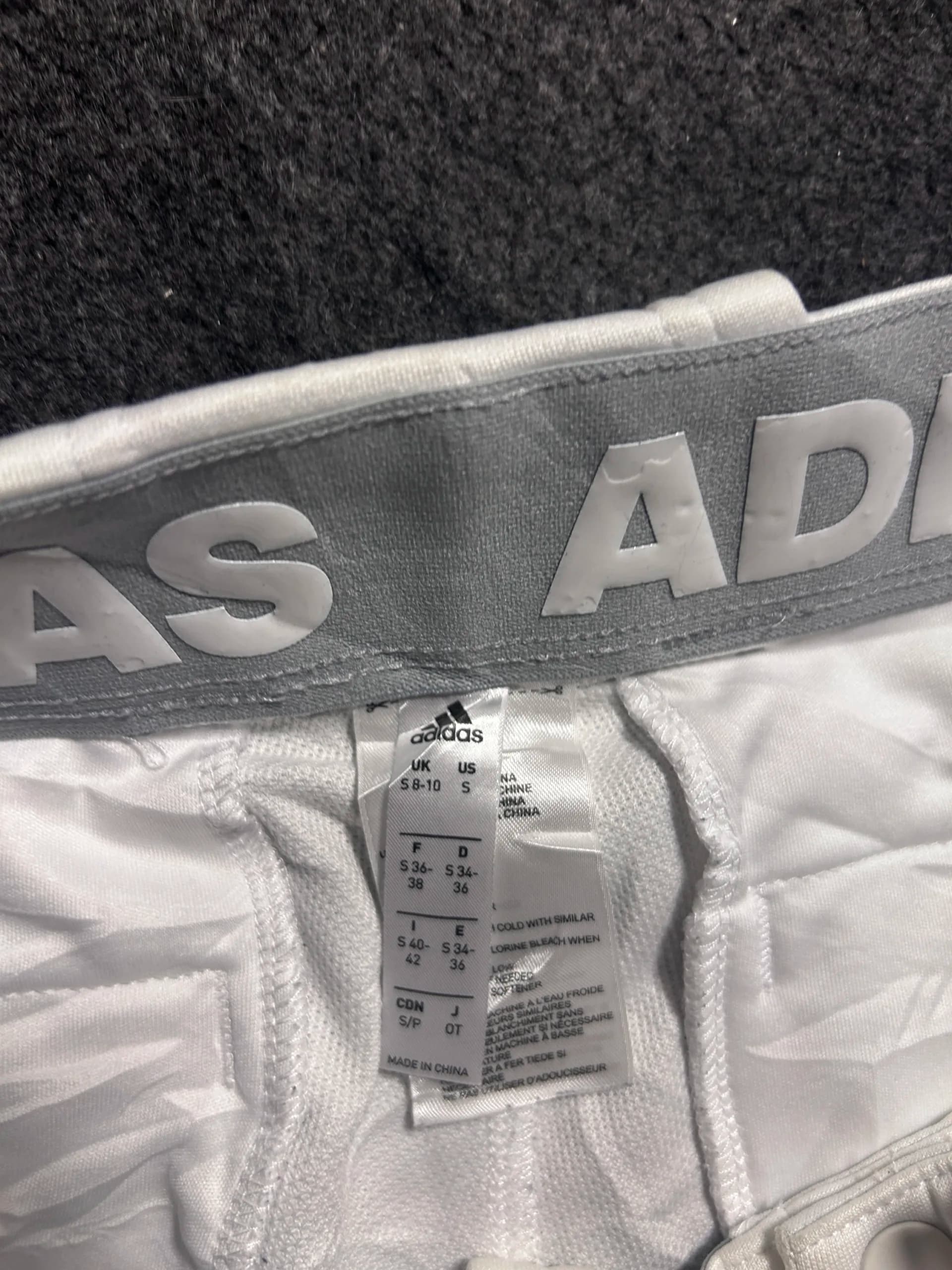 Adidas thrift pants India close-up
