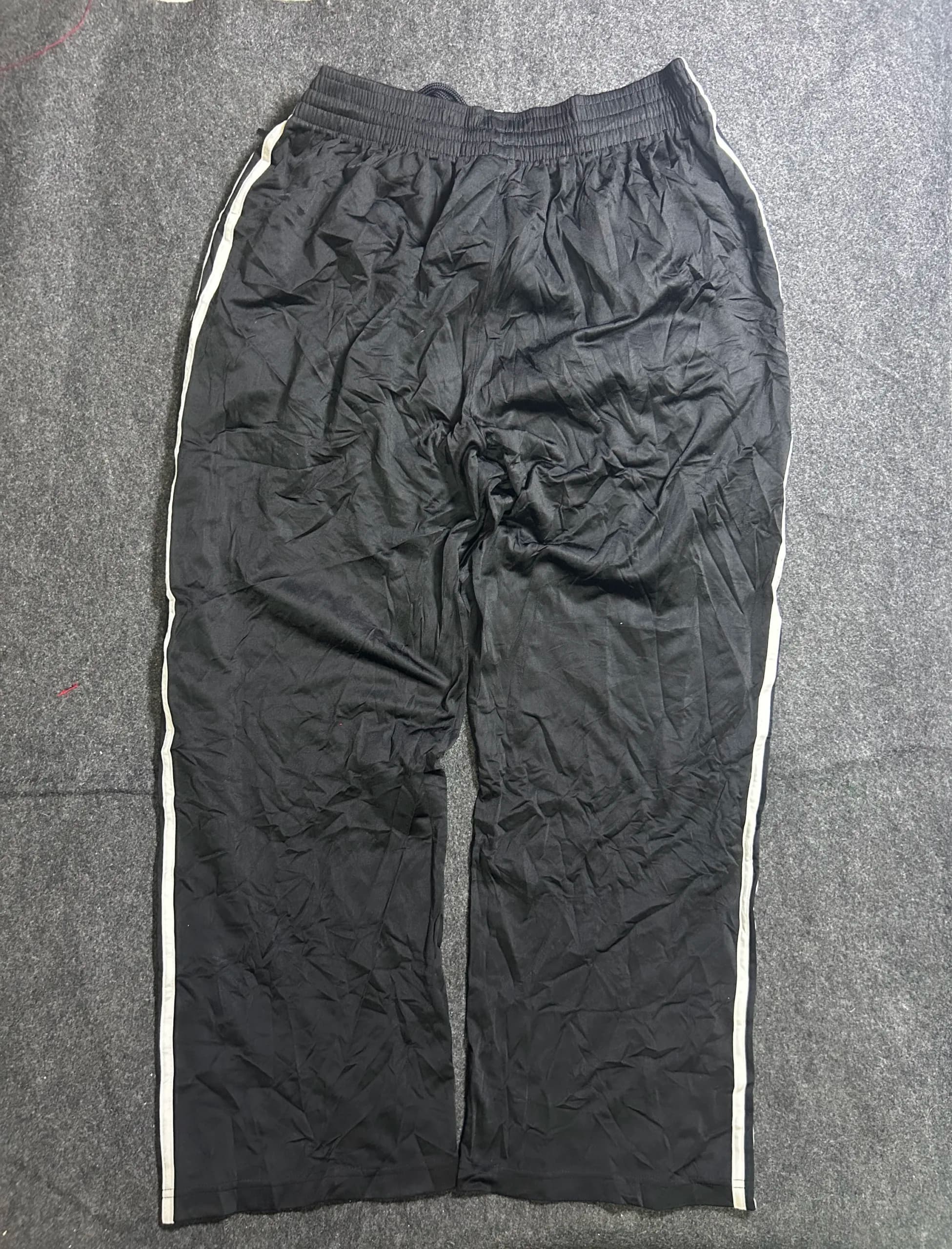 Adidas thrift track pants India close-up
