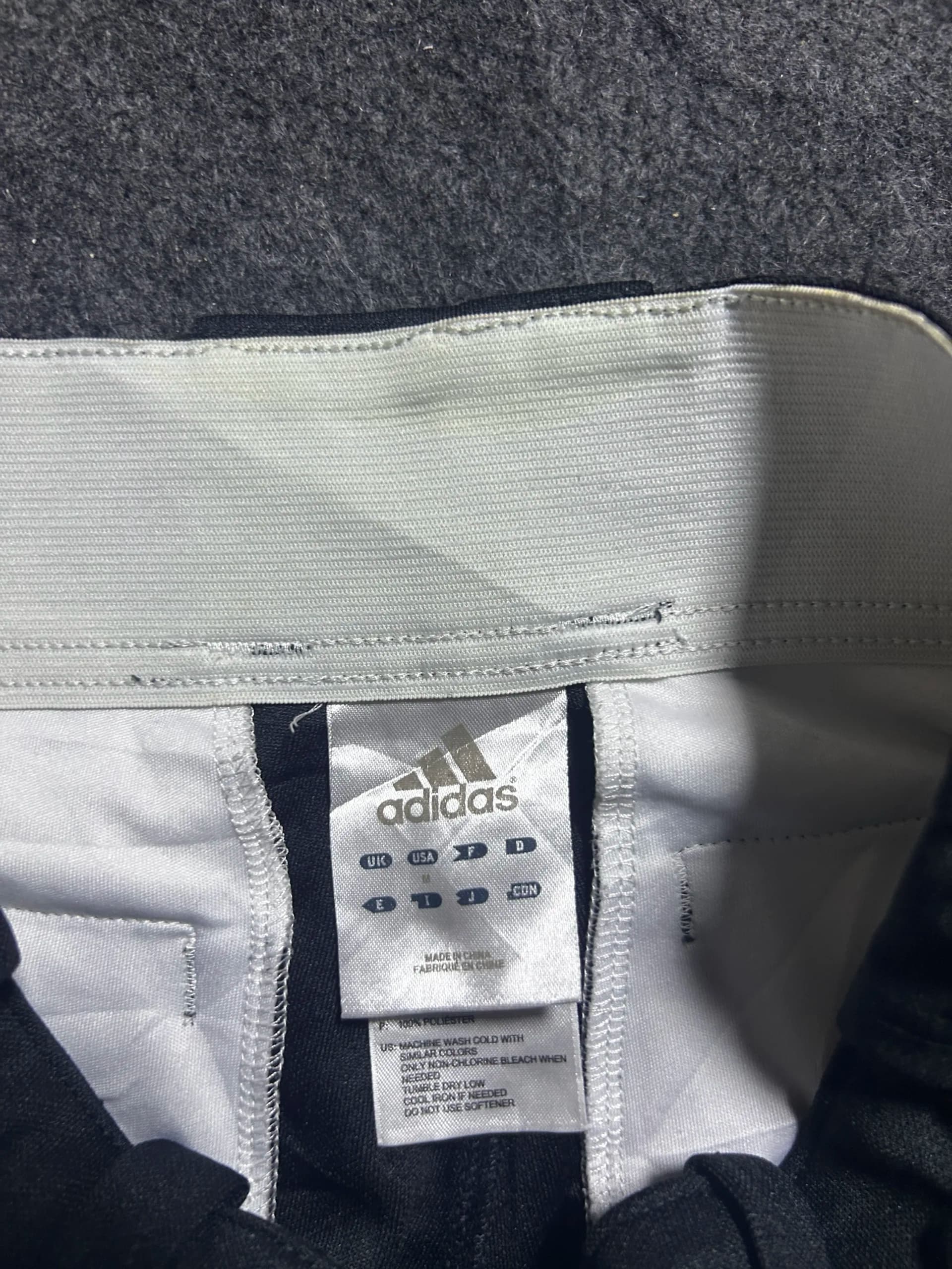 Adidas thrift shorts India close-up