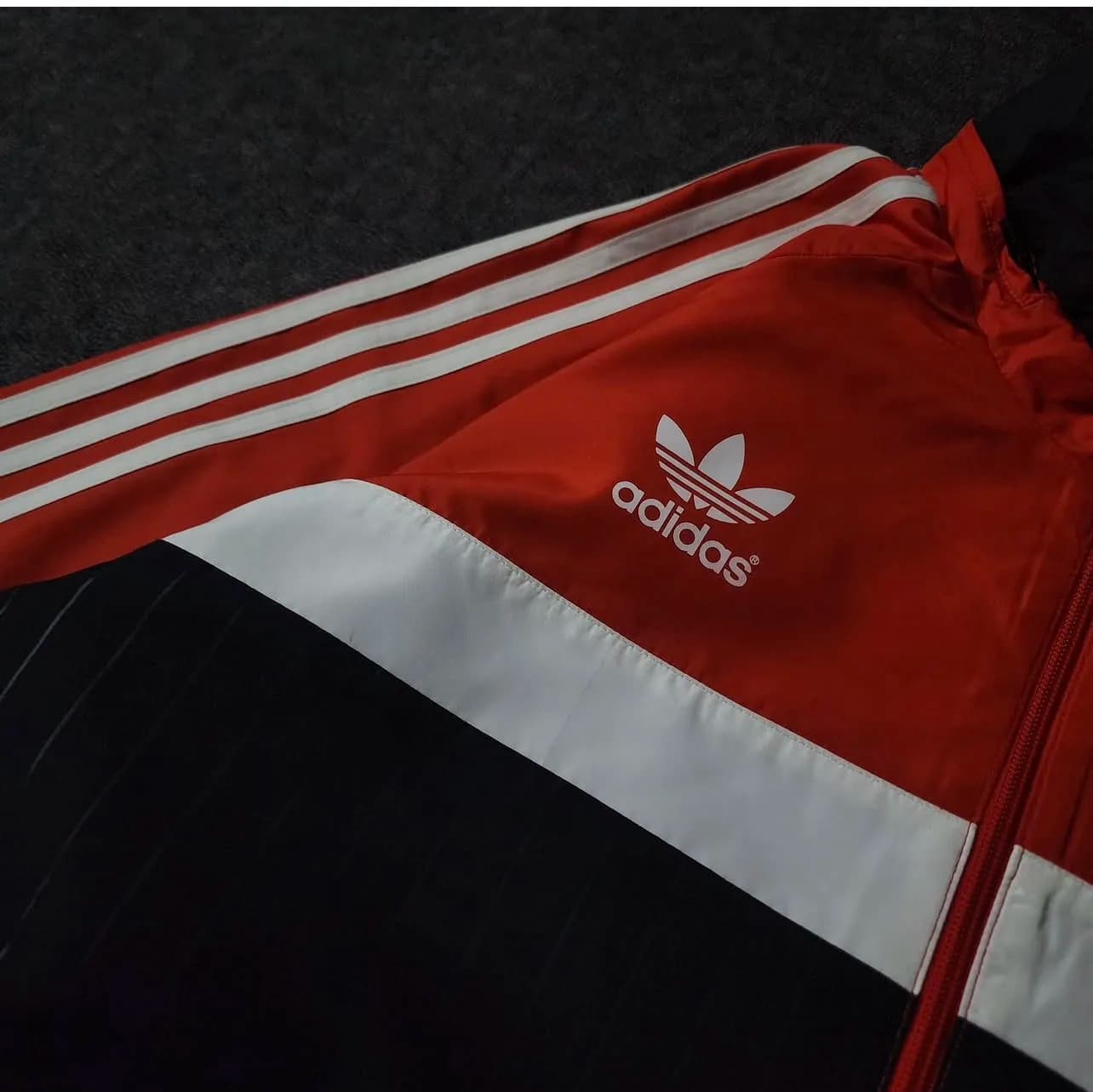 Adidas thrift track jacket India close-up