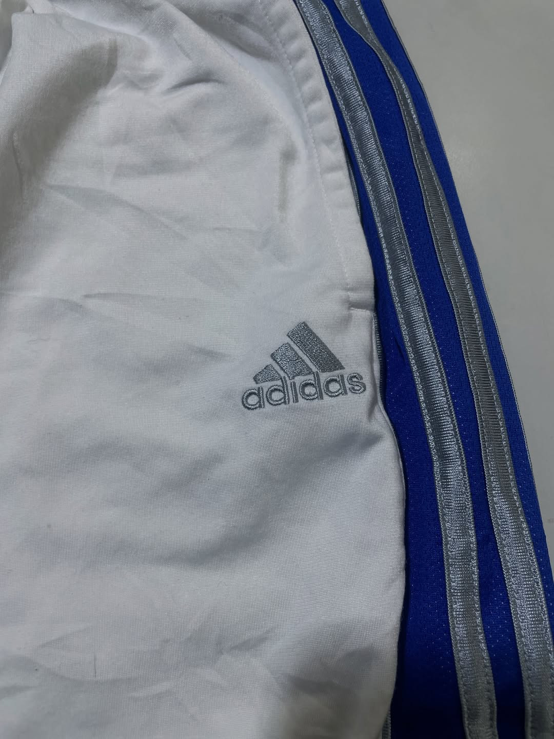 Adidas white with blue strips track pant size M