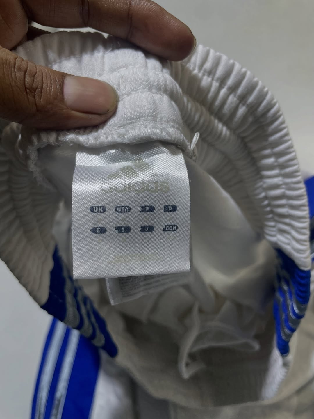 Adidas white with blue strips track pant size M
